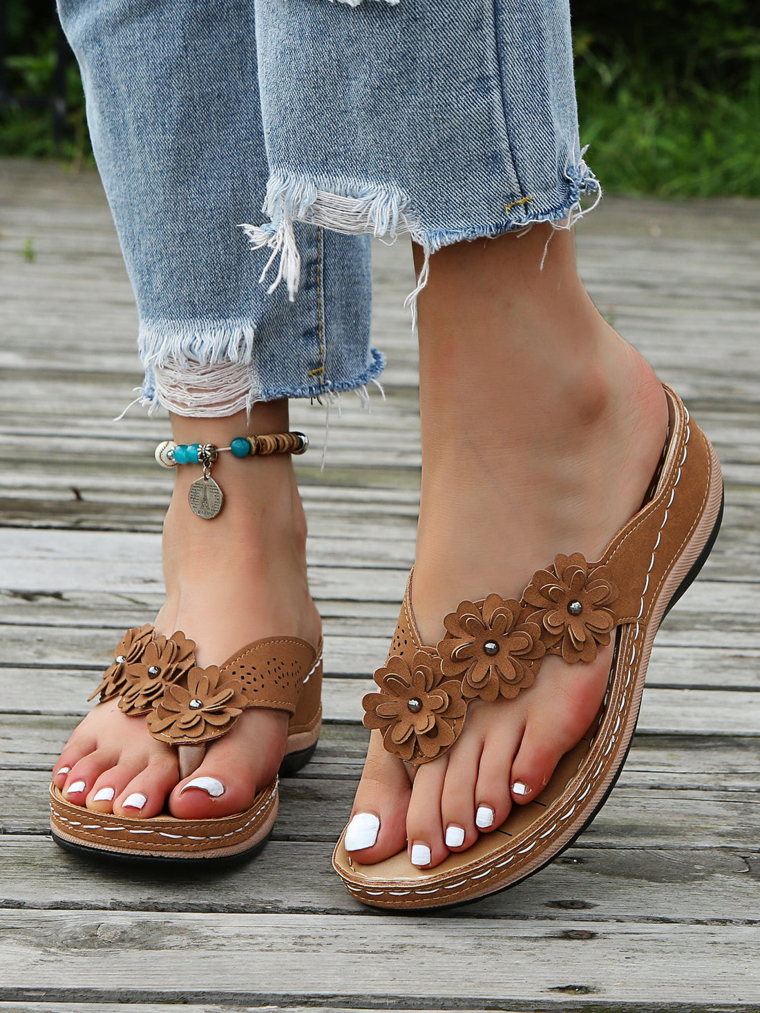 Women's floral stitching pointed-toe wedge flip flops with thick sole, toe-post design, and rhinestone detail