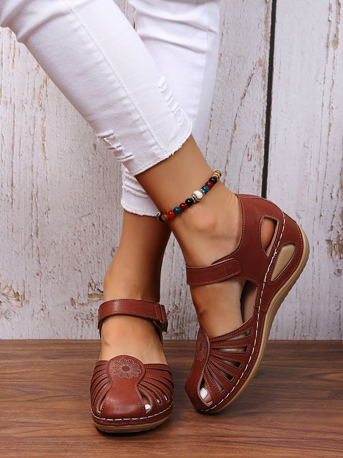Women's classic wedge sandals with cut-out upper, ankle strap, hook-and-loop closure, round toe, and mid wedge heel for casual outdoor wear.