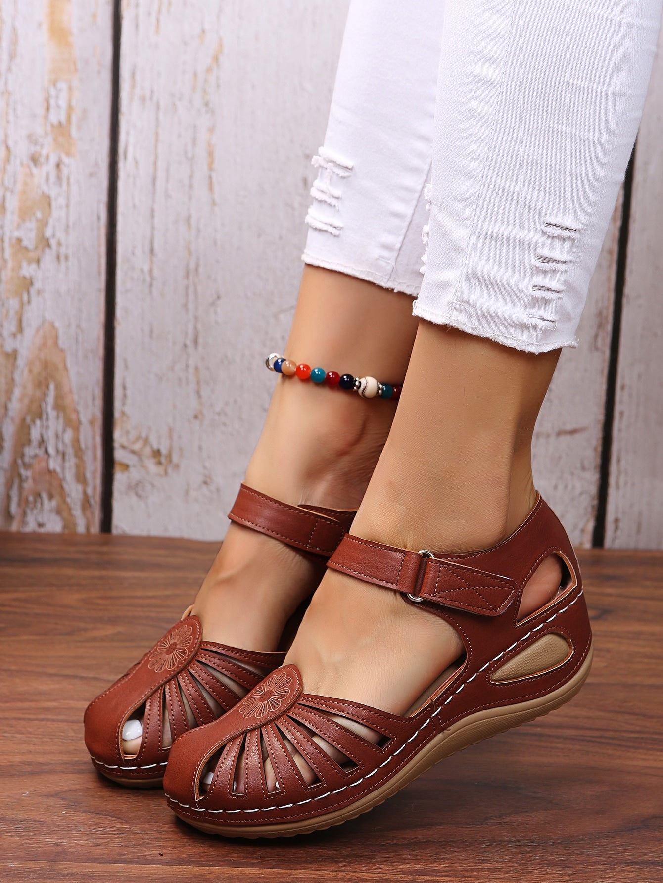 Women's classic wedge sandals with cut-out upper, ankle strap, hook-and-loop closure, round toe, and mid wedge heel for casual outdoor wear.