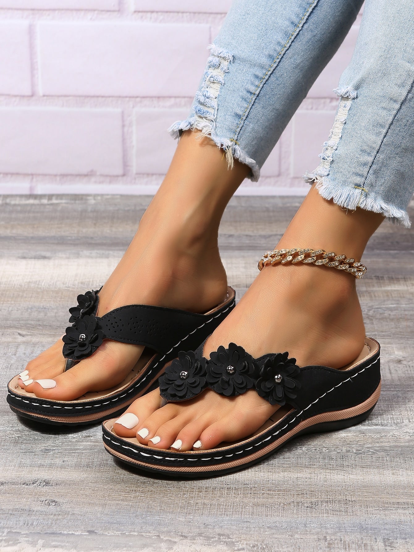 Women's floral stitching pointed-toe wedge flip flops with thick sole, toe-post design, and rhinestone detail