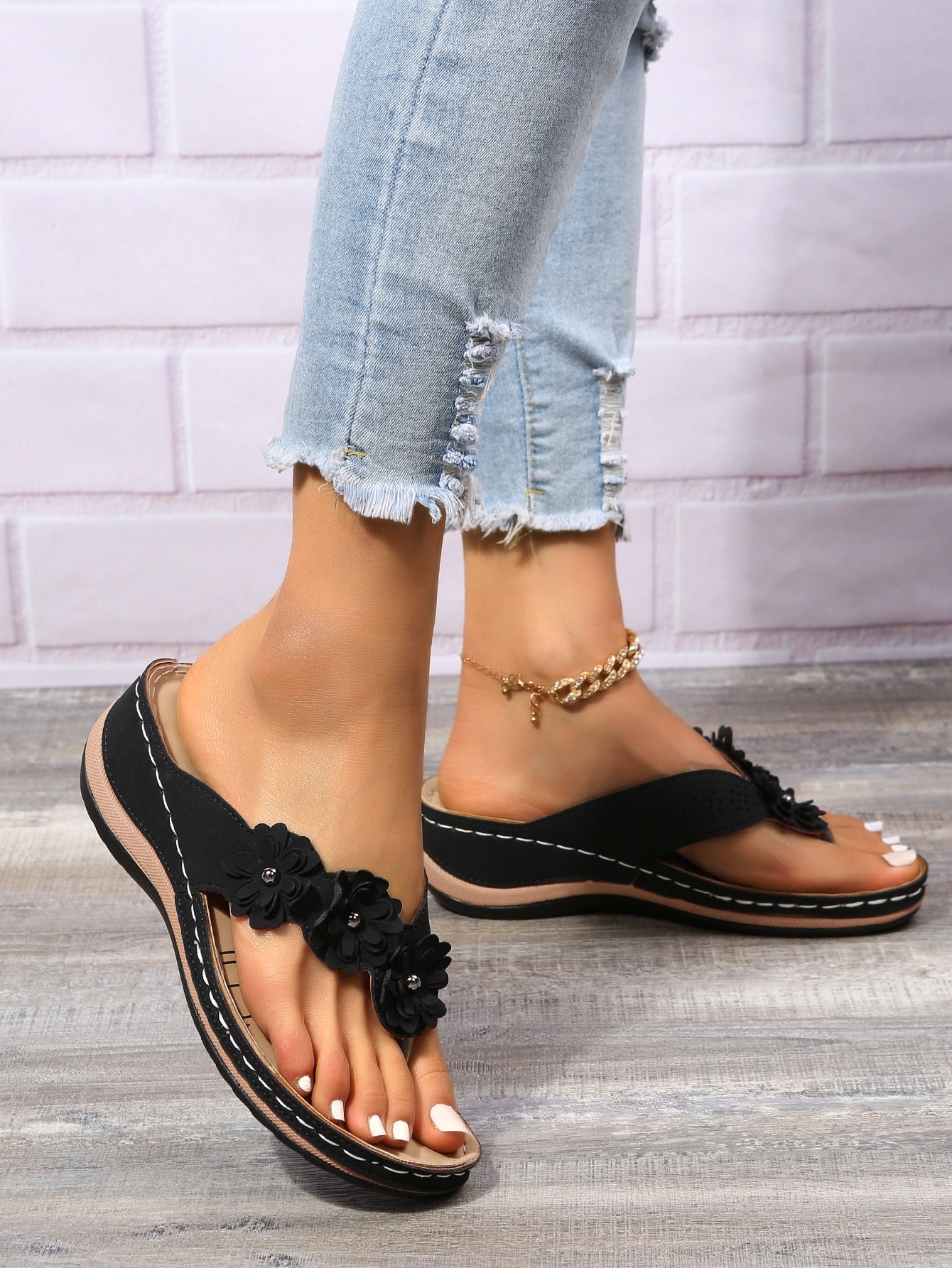 Women's floral stitching pointed-toe wedge flip flops with thick sole, toe-post design, and rhinestone detail