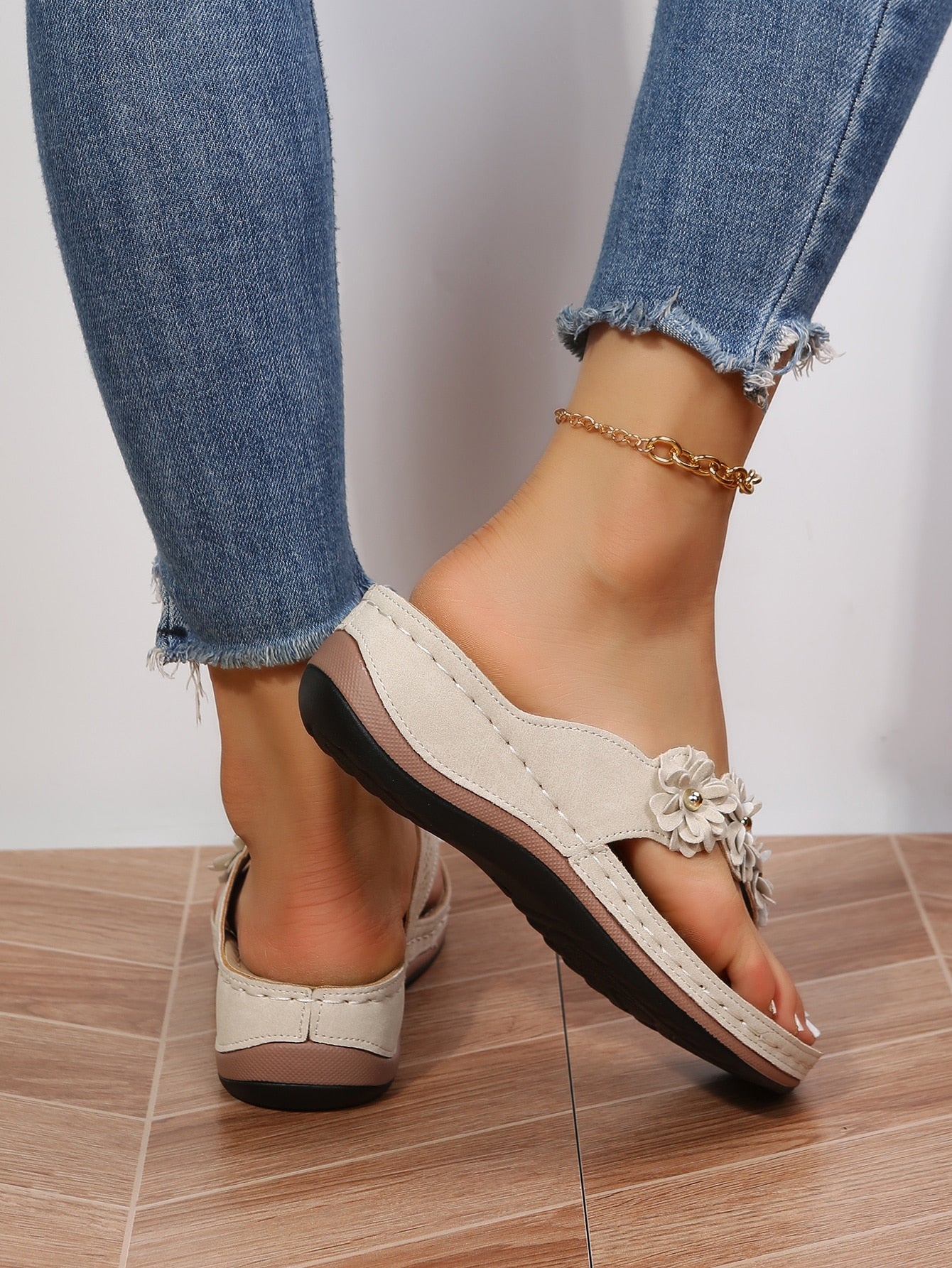 Women's floral stitching pointed-toe wedge flip flops with thick sole, toe-post design, and rhinestone detail