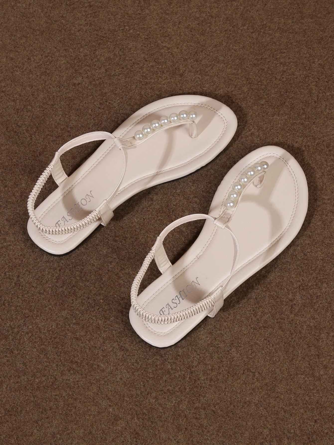 Women’s Roman style strap slide sandals with flat sole, buckle detail, and round toe, designed as casual slip-on beach and outdoor sandals.