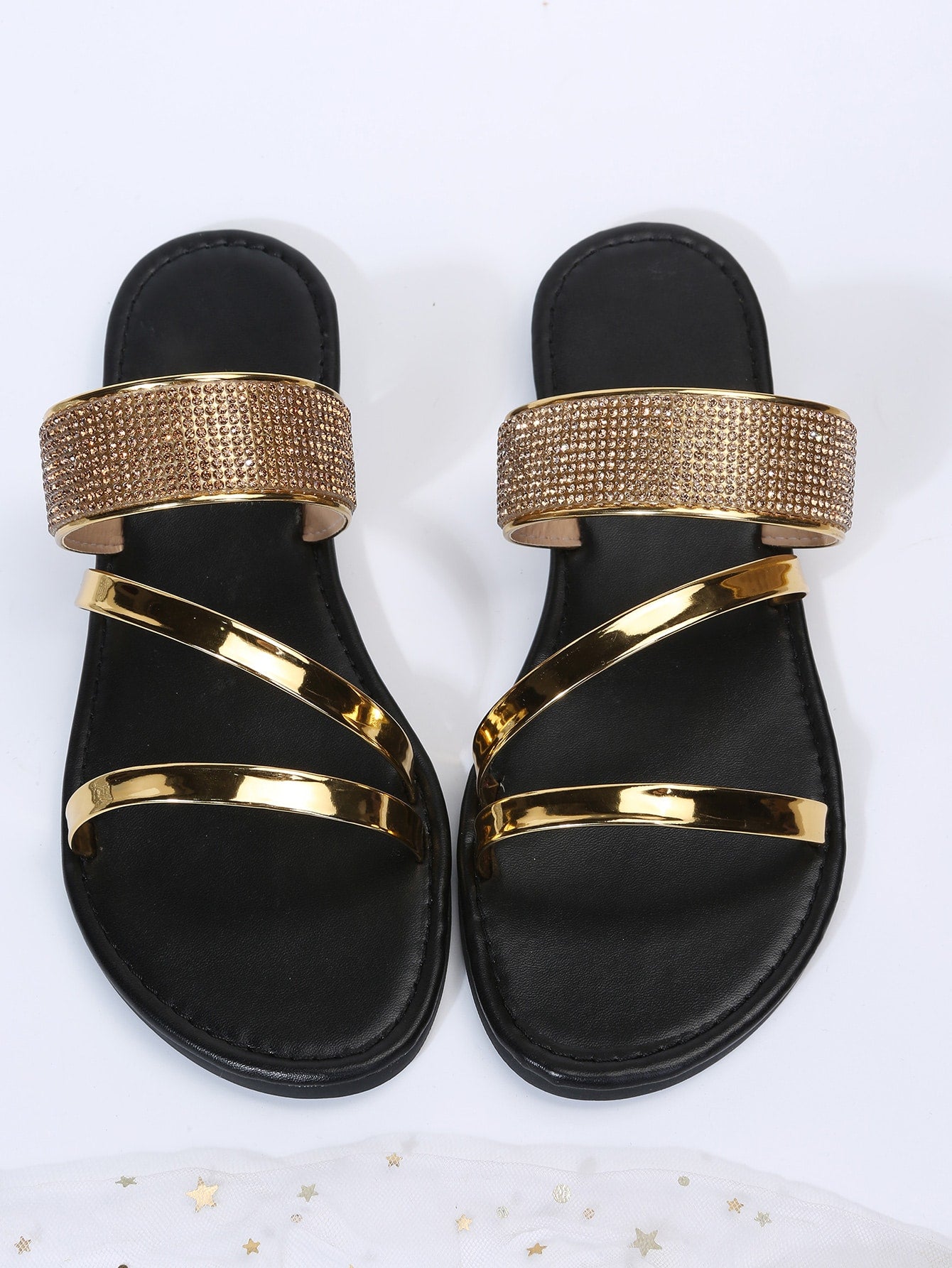 Women's gold thong flat slide sandals with rhinestone detail, open toe design, PU leather upper and lining, and rubber outsole.