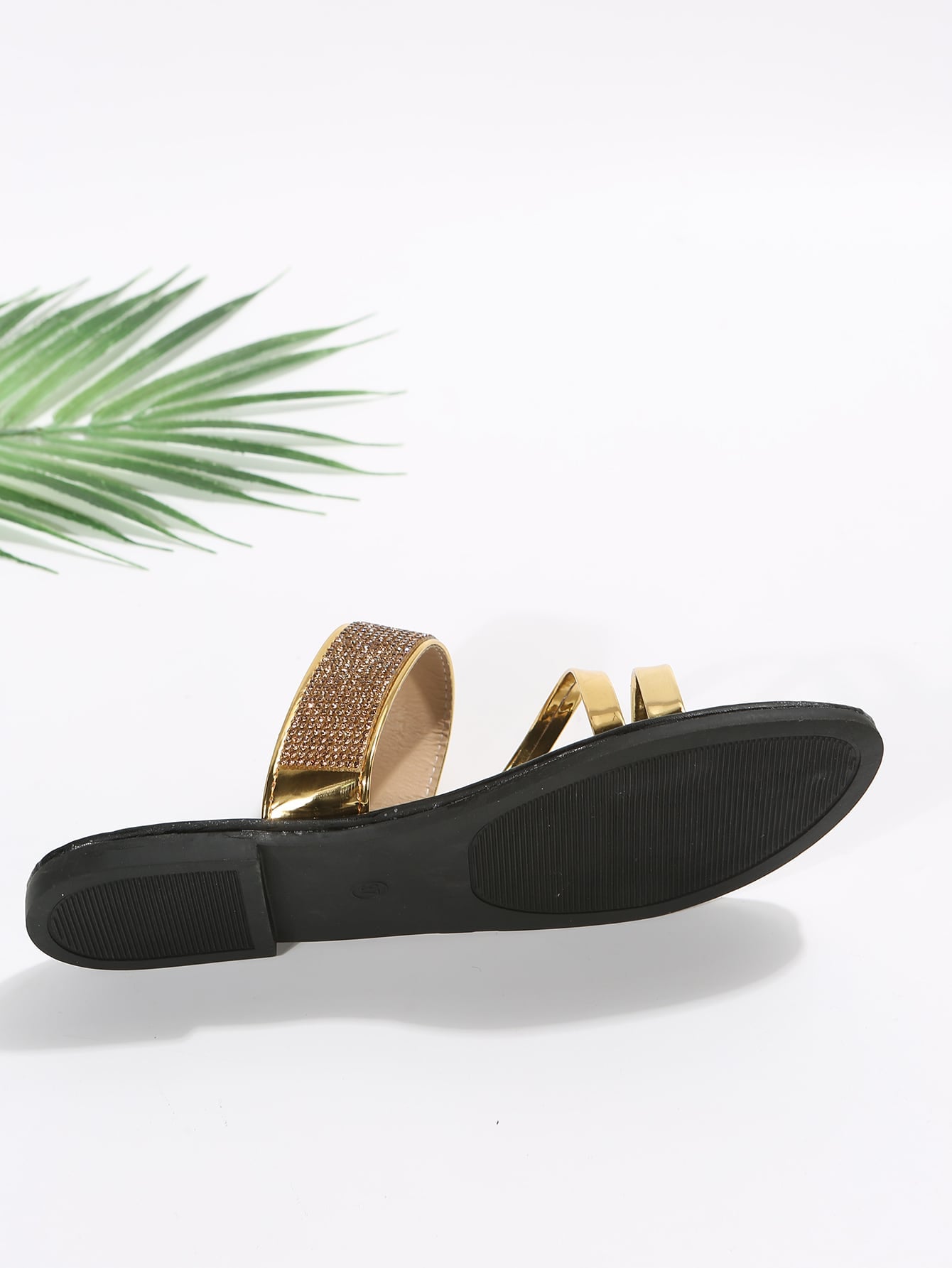 Women's gold thong flat slide sandals with rhinestone detail, open toe design, PU leather upper and lining, and rubber outsole.