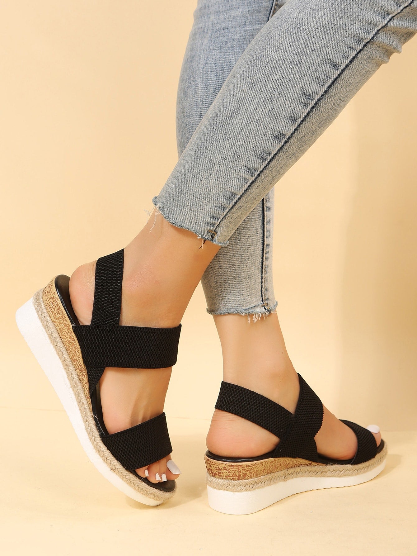 Women's slip-on crisscross wedge sandals with open toe, slingback strap, buckle detail, and mid wedge heel in a casual style.