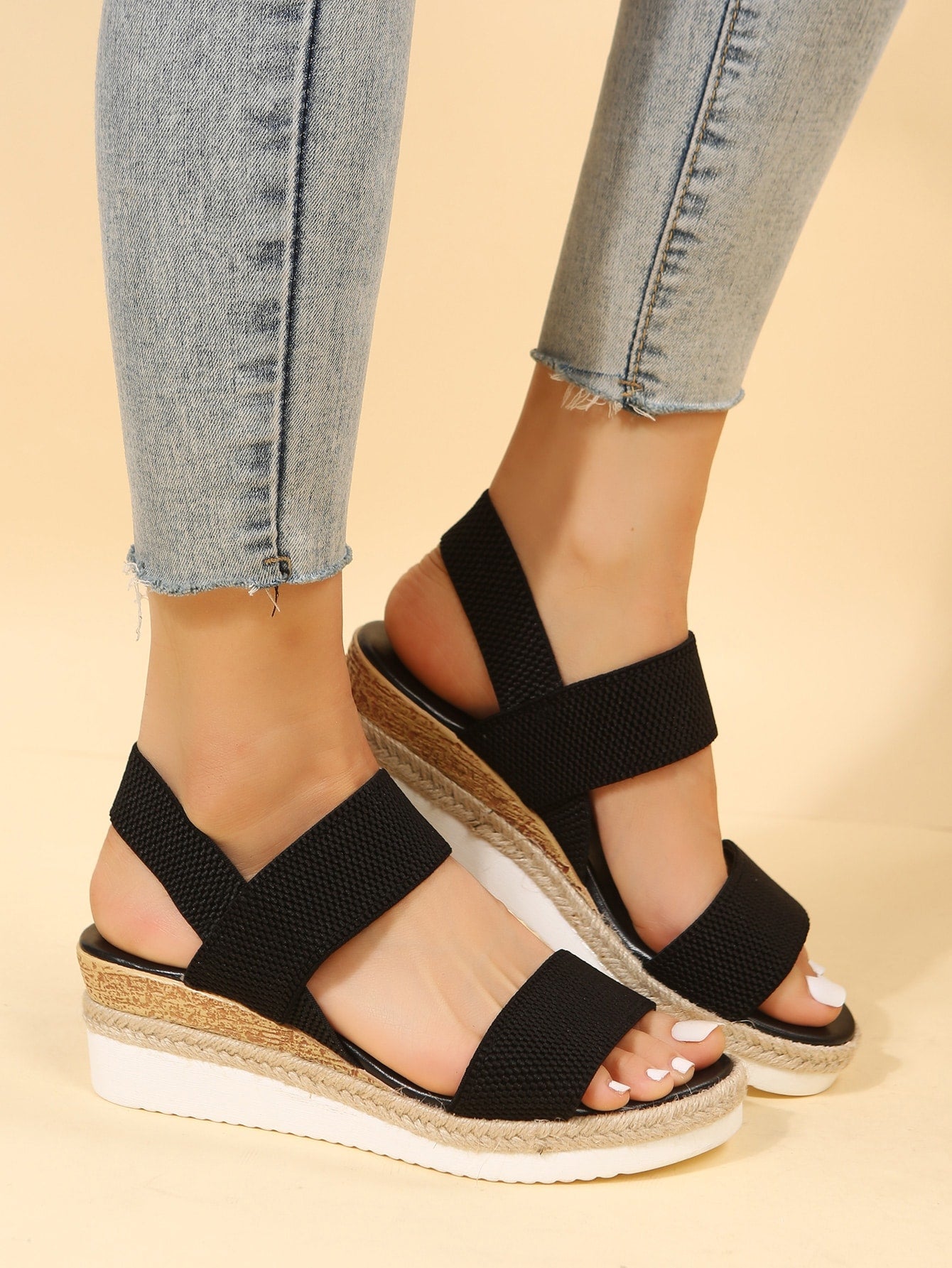 Women's slip-on crisscross wedge sandals with open toe, slingback strap, buckle detail, and mid wedge heel in a casual style.