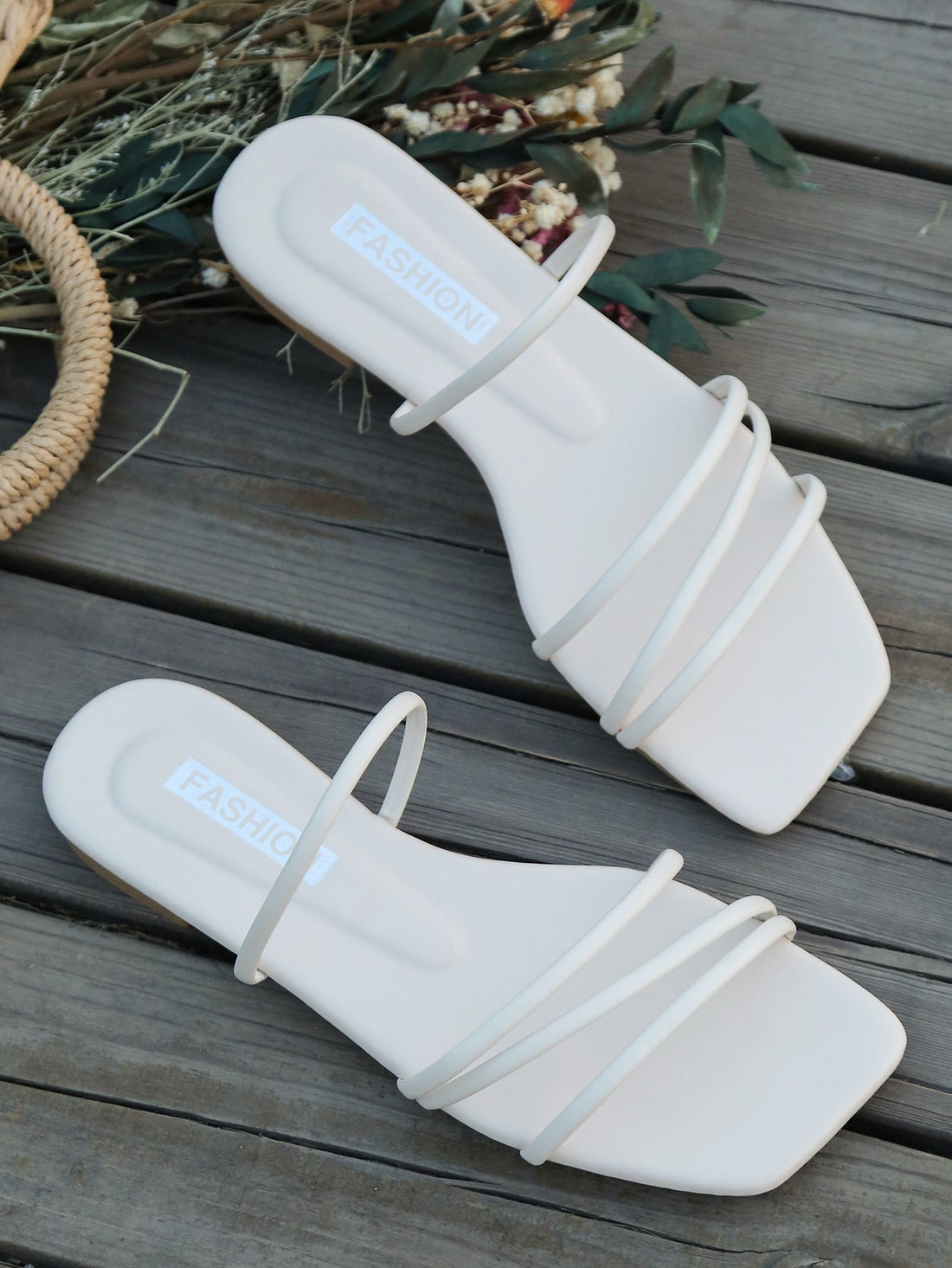 Casual striped flat slide sandals with beaded detail and open toe, beach-style slip-on design.