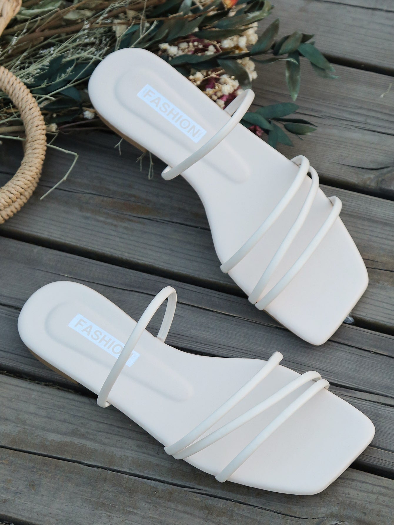 Casual striped flat slide sandals with beaded detail and open toe, beach-style slip-on design.
