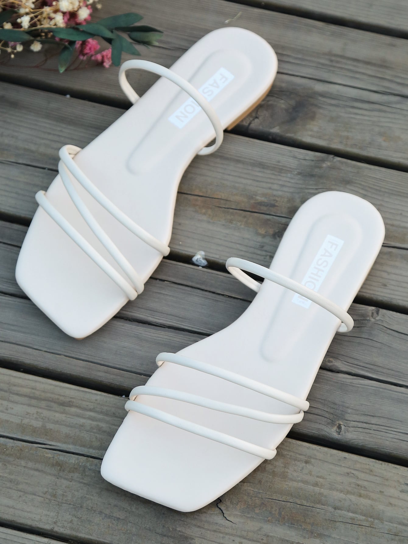 Casual striped flat slide sandals with beaded detail and open toe, beach-style slip-on design.