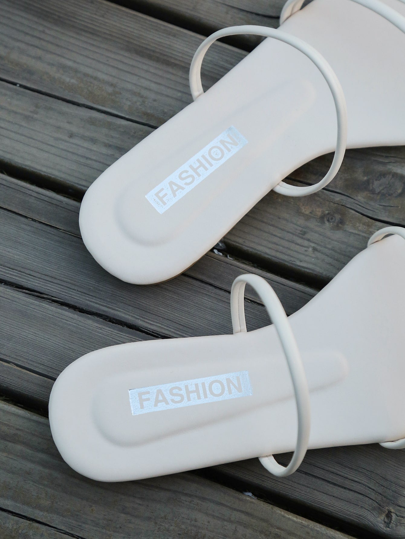 Casual striped flat slide sandals with beaded detail and open toe, beach-style slip-on design.