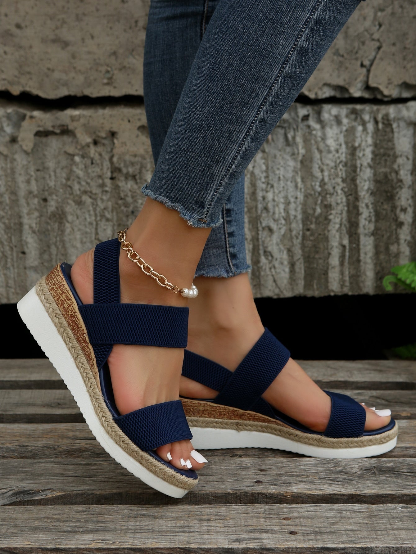 Women's slip-on crisscross wedge sandals with open toe, slingback strap, buckle detail, and mid wedge heel in a casual style.