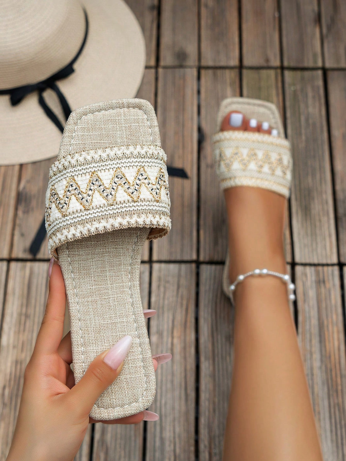 Pair of women's embroidered woven flat slingback sandals with open toe and multicolor floral-inspired detailing, designed for vacation and outdoor wear.