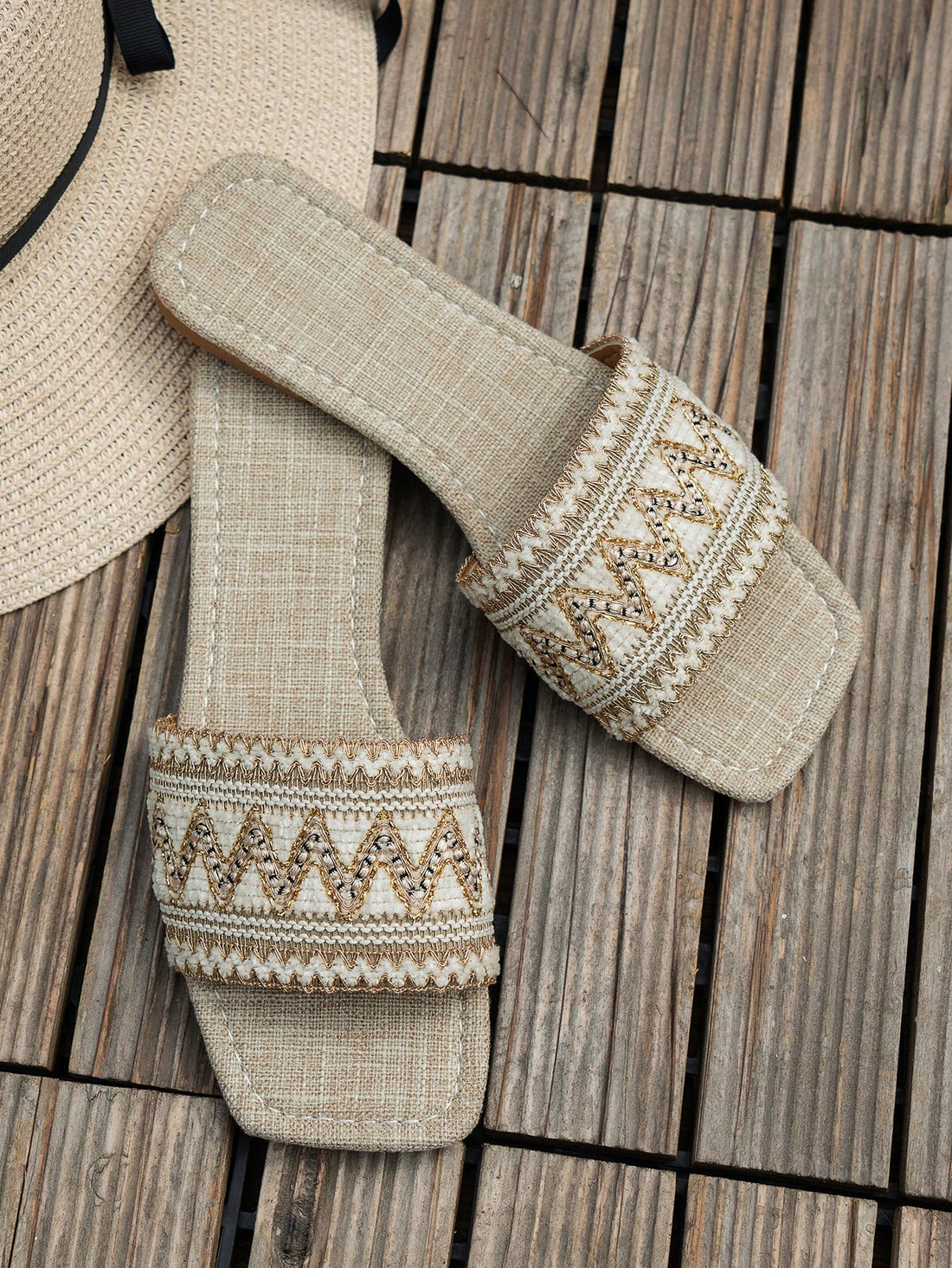 Pair of women's embroidered woven flat slingback sandals with open toe and multicolor floral-inspired detailing, designed for vacation and outdoor wear.