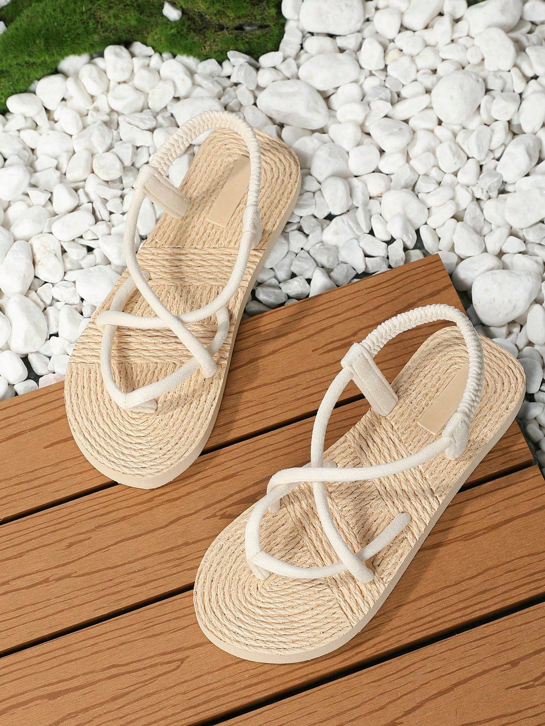Women's flat gladiator sandals featuring criss cross straps, elastic band design, open toe, and non-slip sole in a solid-color bohemian style for indoor and outdoor wear.