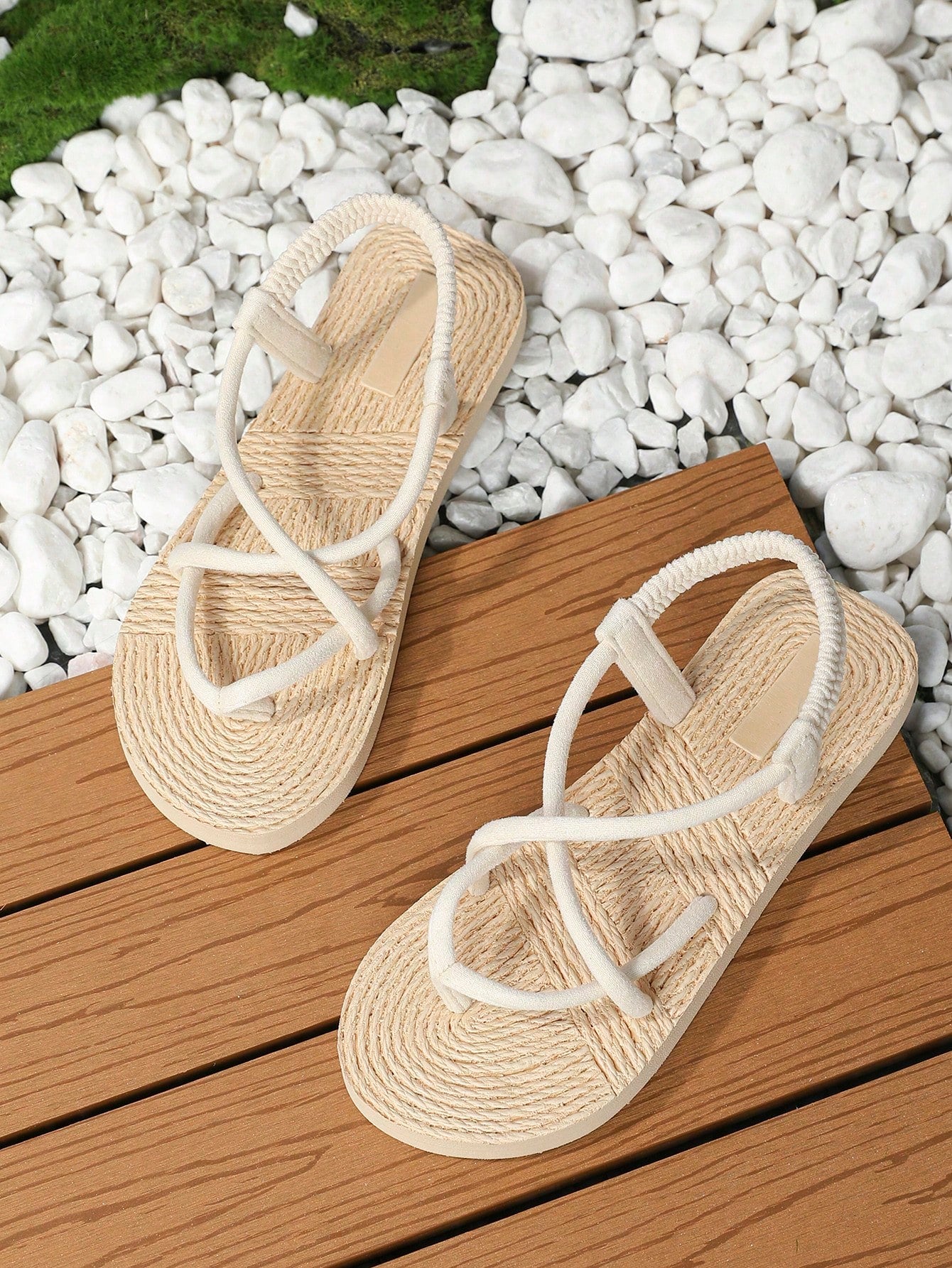 Women's flat gladiator sandals featuring criss cross straps, elastic band design, open toe, and non-slip sole in a solid-color bohemian style for indoor and outdoor wear.