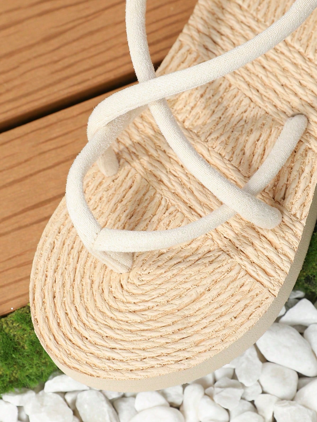 Women's flat gladiator sandals featuring criss cross straps, elastic band design, open toe, and non-slip sole in a solid-color bohemian style for indoor and outdoor wear.