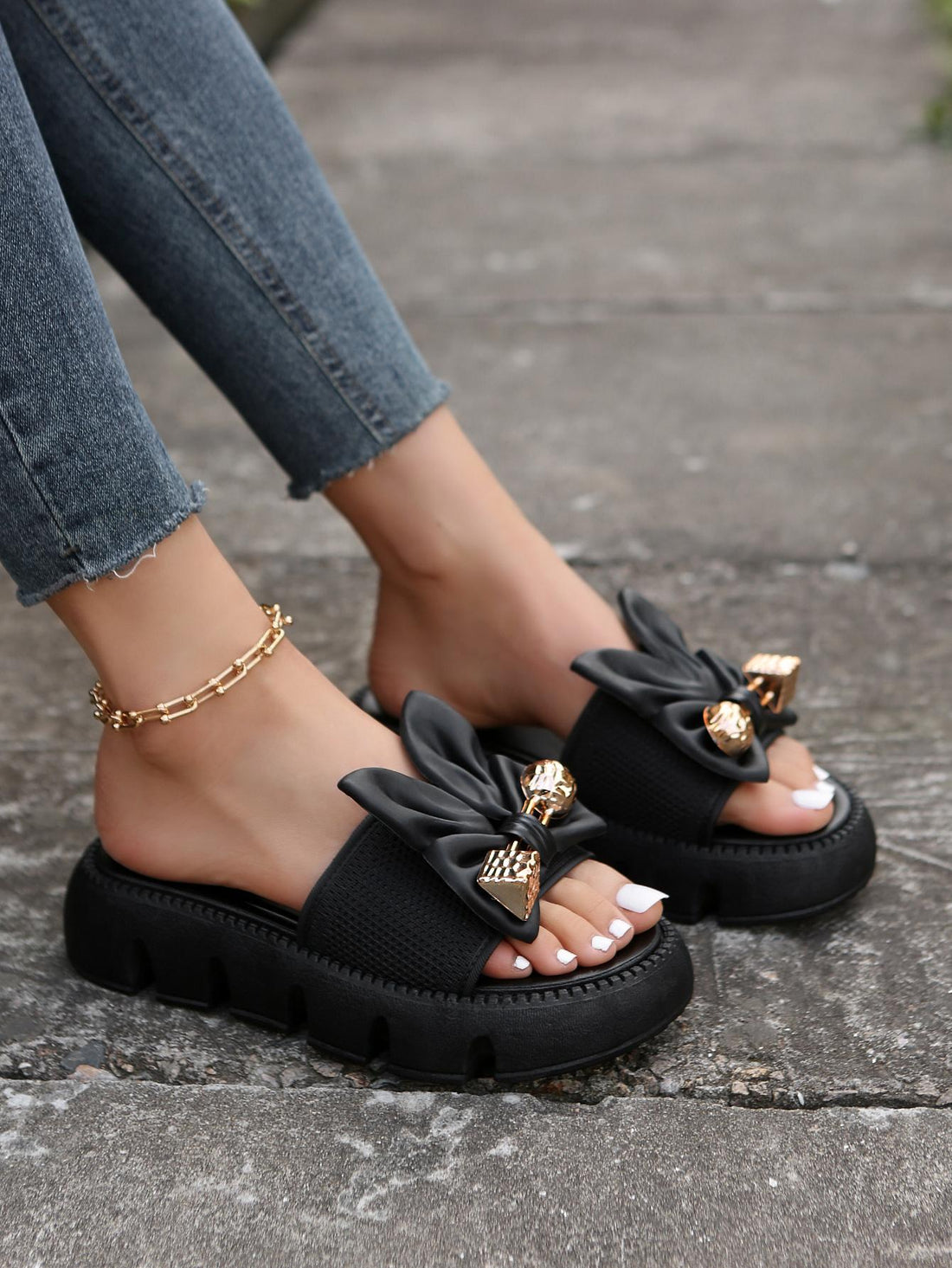 Women's plus size thick sole slip-on sandals with bowknot detail, open toe design, low heel, and PU leather upper.