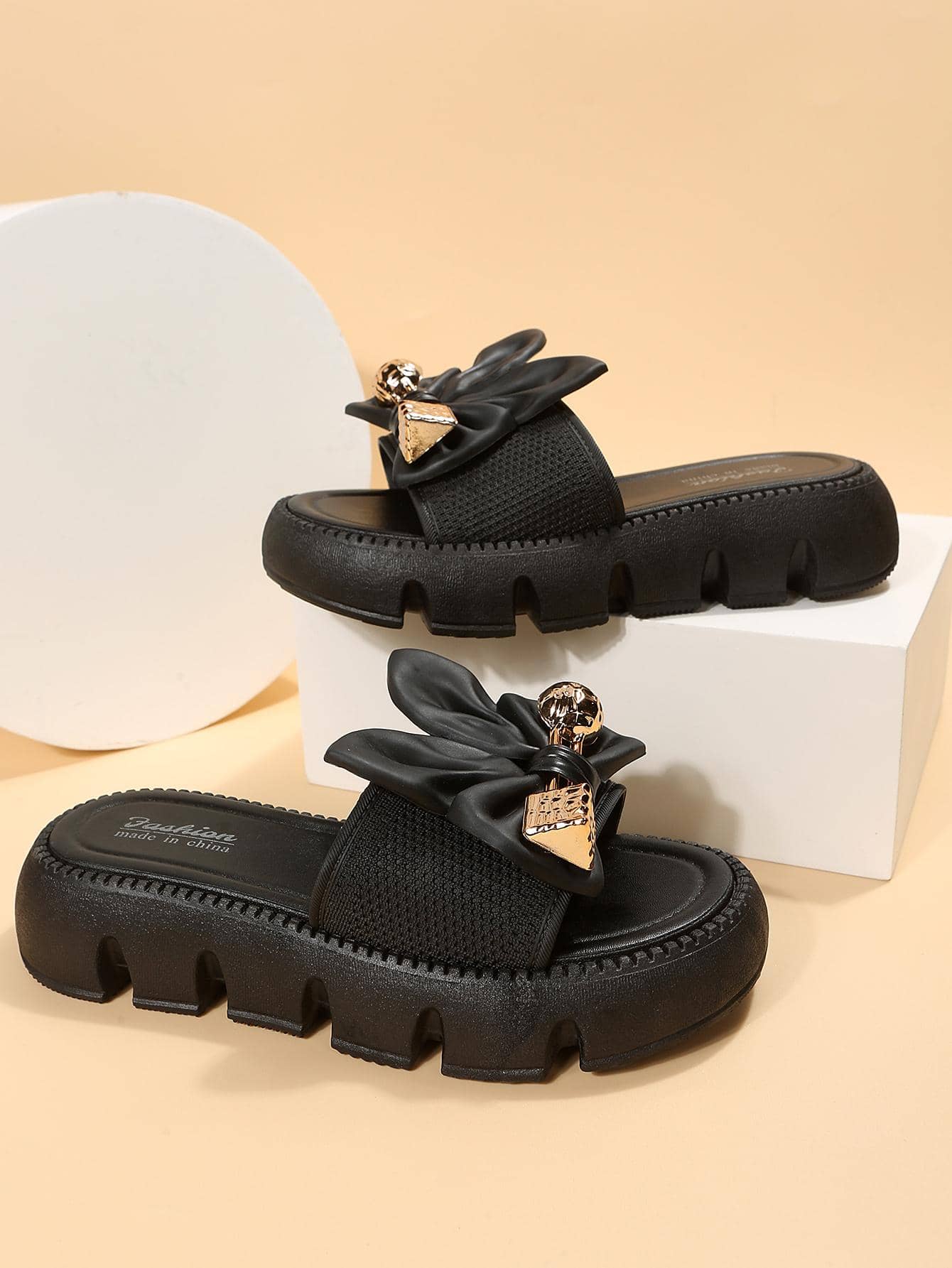 Women's plus size thick sole slip-on sandals with bowknot detail, open toe design, low heel, and PU leather upper.