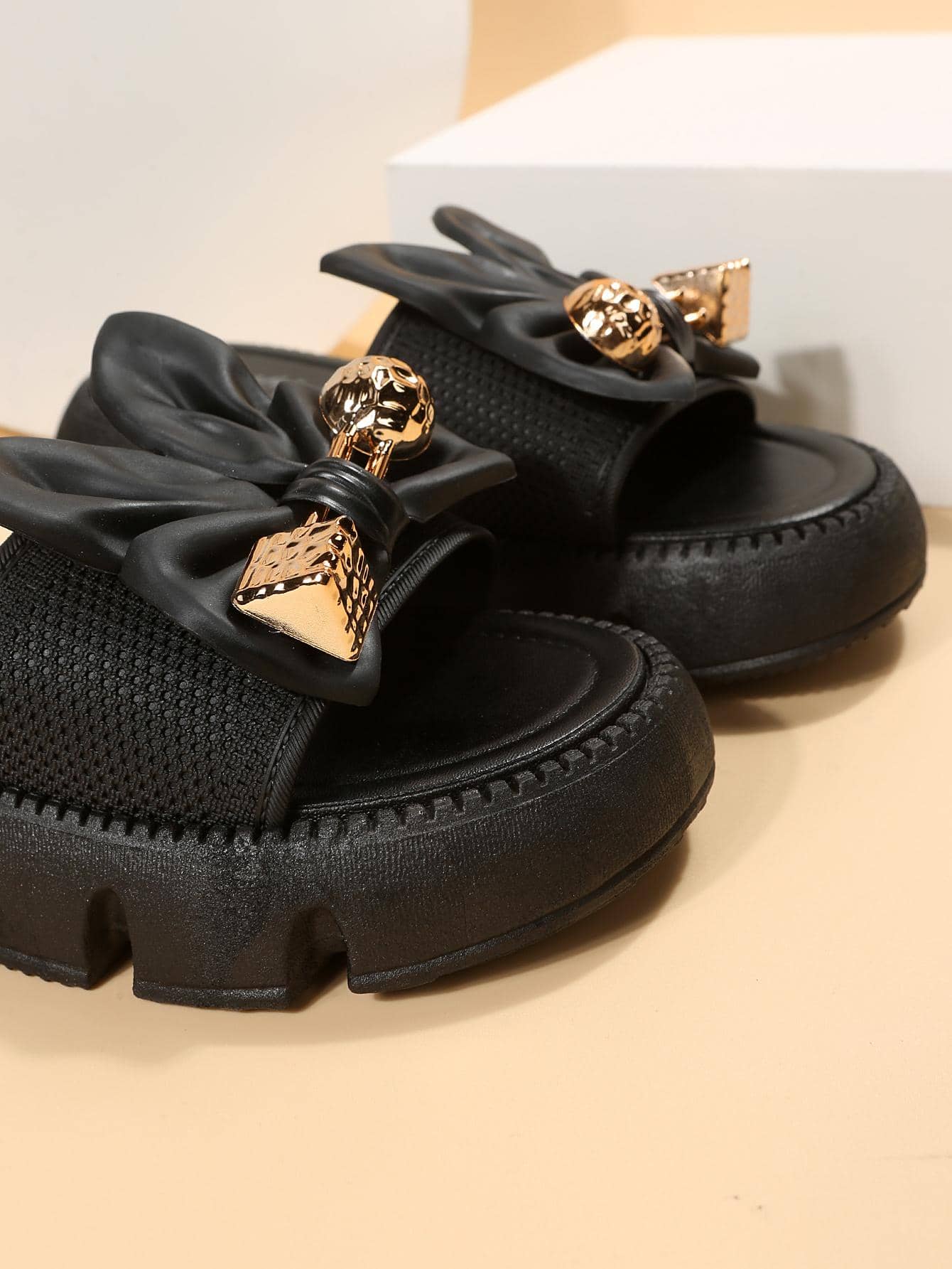 Women's plus size thick sole slip-on sandals with bowknot detail, open toe design, low heel, and PU leather upper.