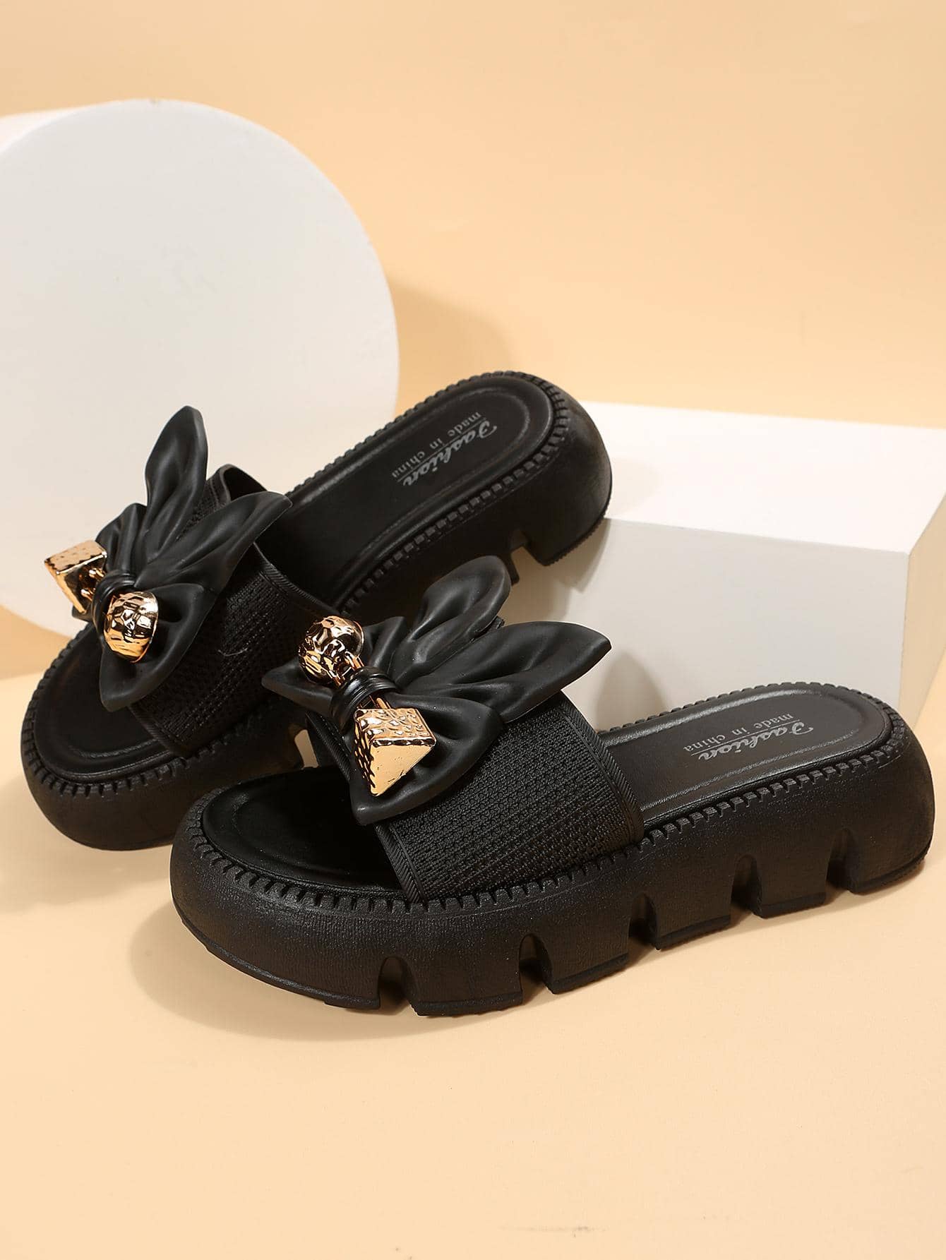 Women's plus size thick sole slip-on sandals with bowknot detail, open toe design, low heel, and PU leather upper.
