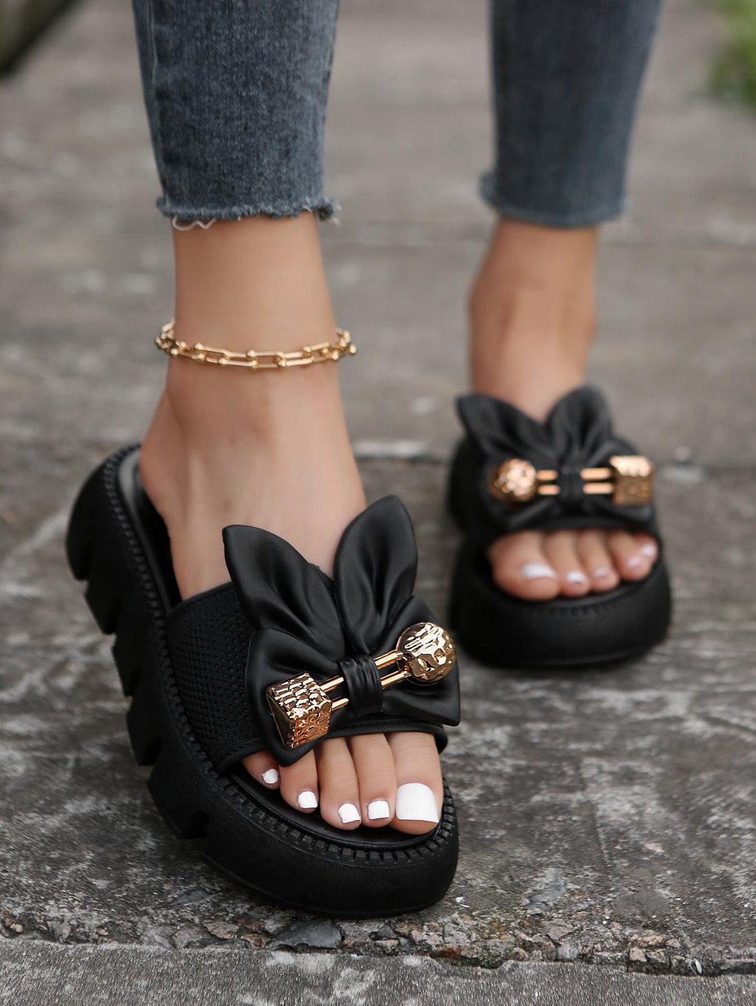 Women's plus size thick sole slip-on sandals with bowknot detail, open toe design, low heel, and PU leather upper.