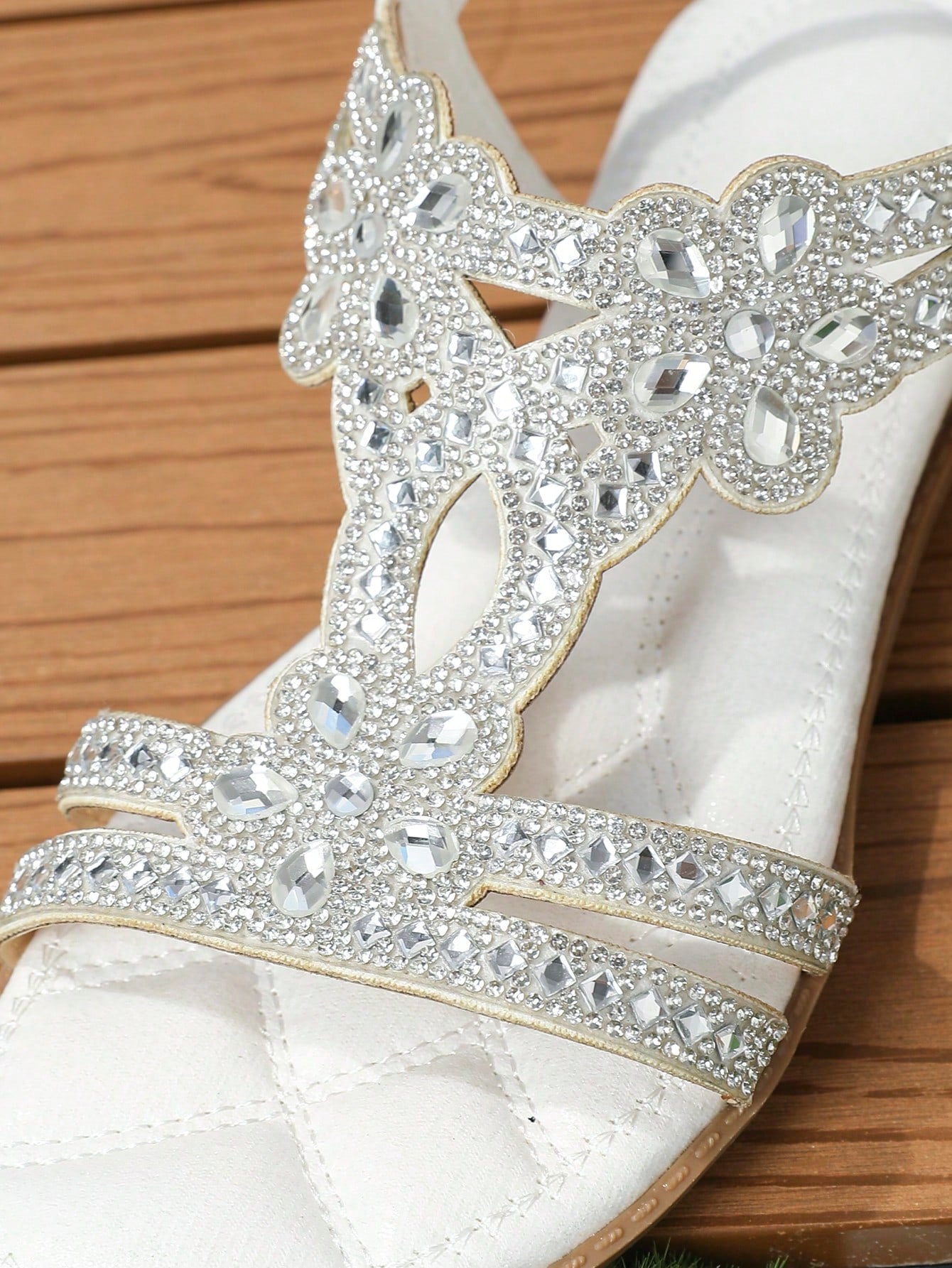 Women’s metallic slingback flat sandals with rhinestone decor, open toe, and ankle strap in a bohemian outdoor style.