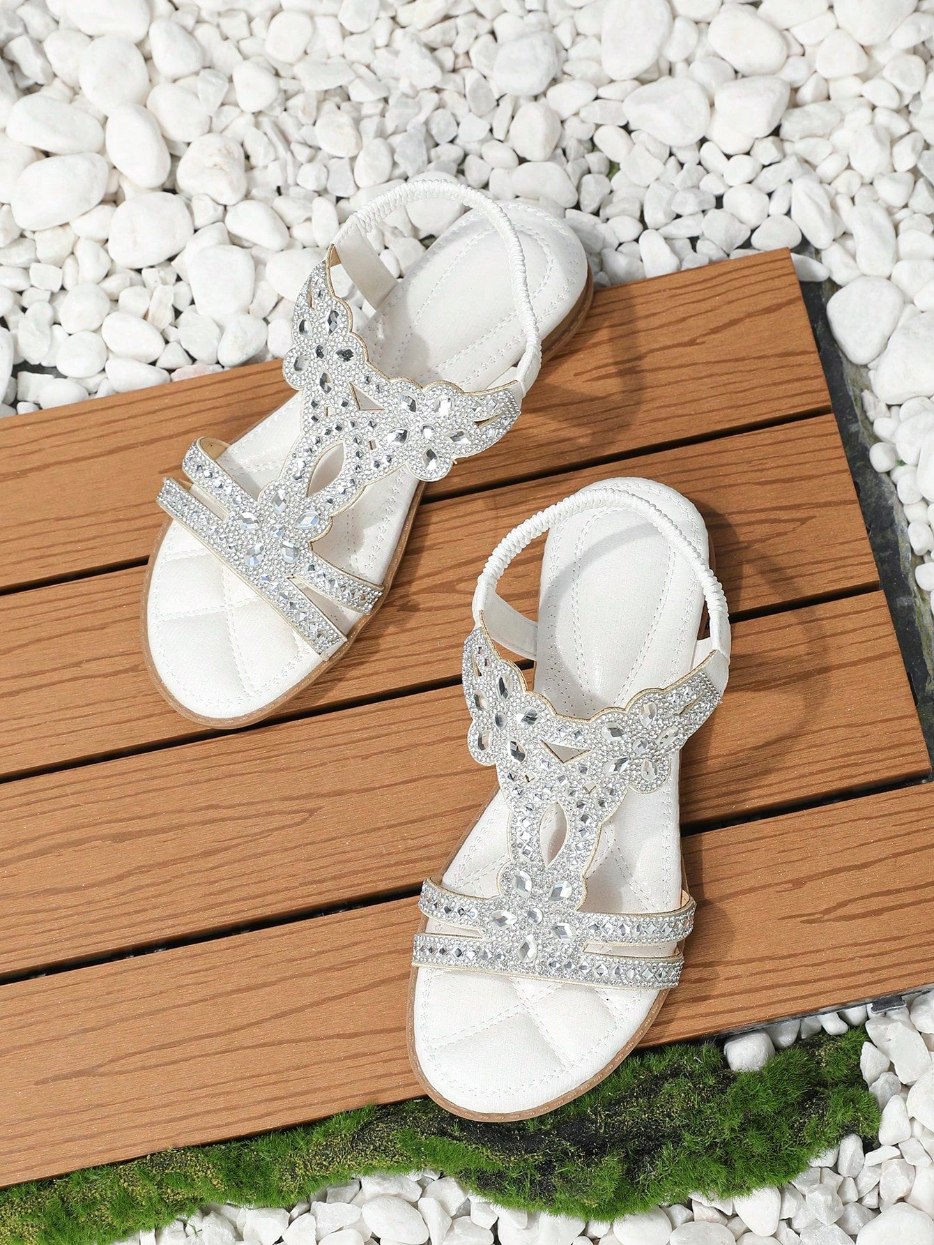Women’s metallic slingback flat sandals with rhinestone decor, open toe, and ankle strap in a bohemian outdoor style.