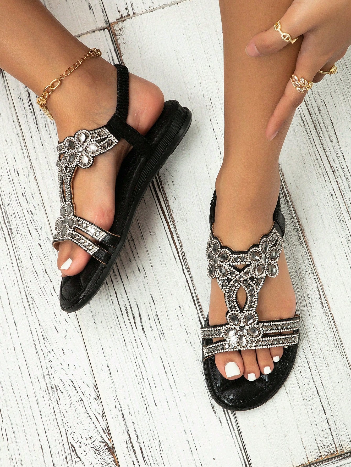 Women’s metallic slingback flat sandals with rhinestone decor, open toe, and ankle strap in a bohemian outdoor style.