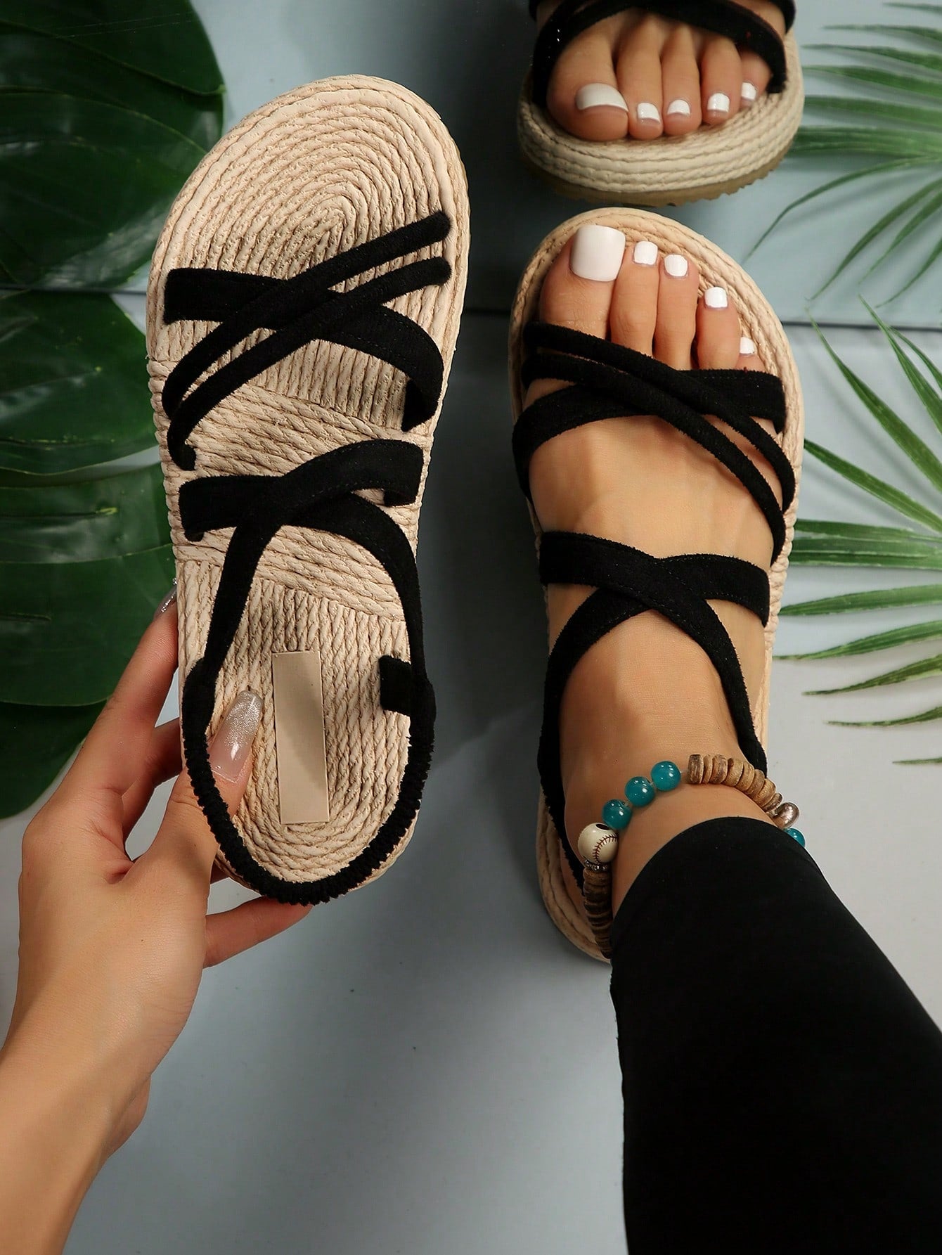Women’s flat open-toe slide sandals with criss-cross woven straps and a plain casual design for daily, beach, and summer outdoor wear.