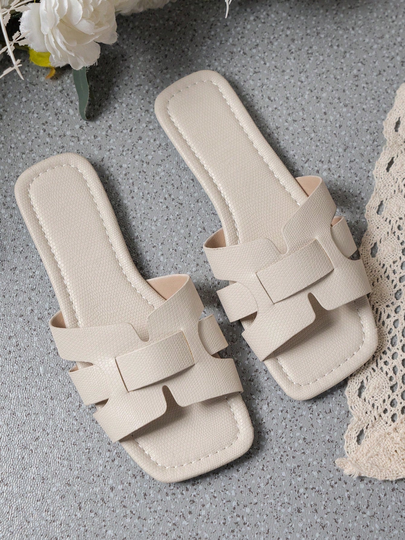 Women's Korean-style casual flat slide sandals with open toe, geometric detail, and pink color.