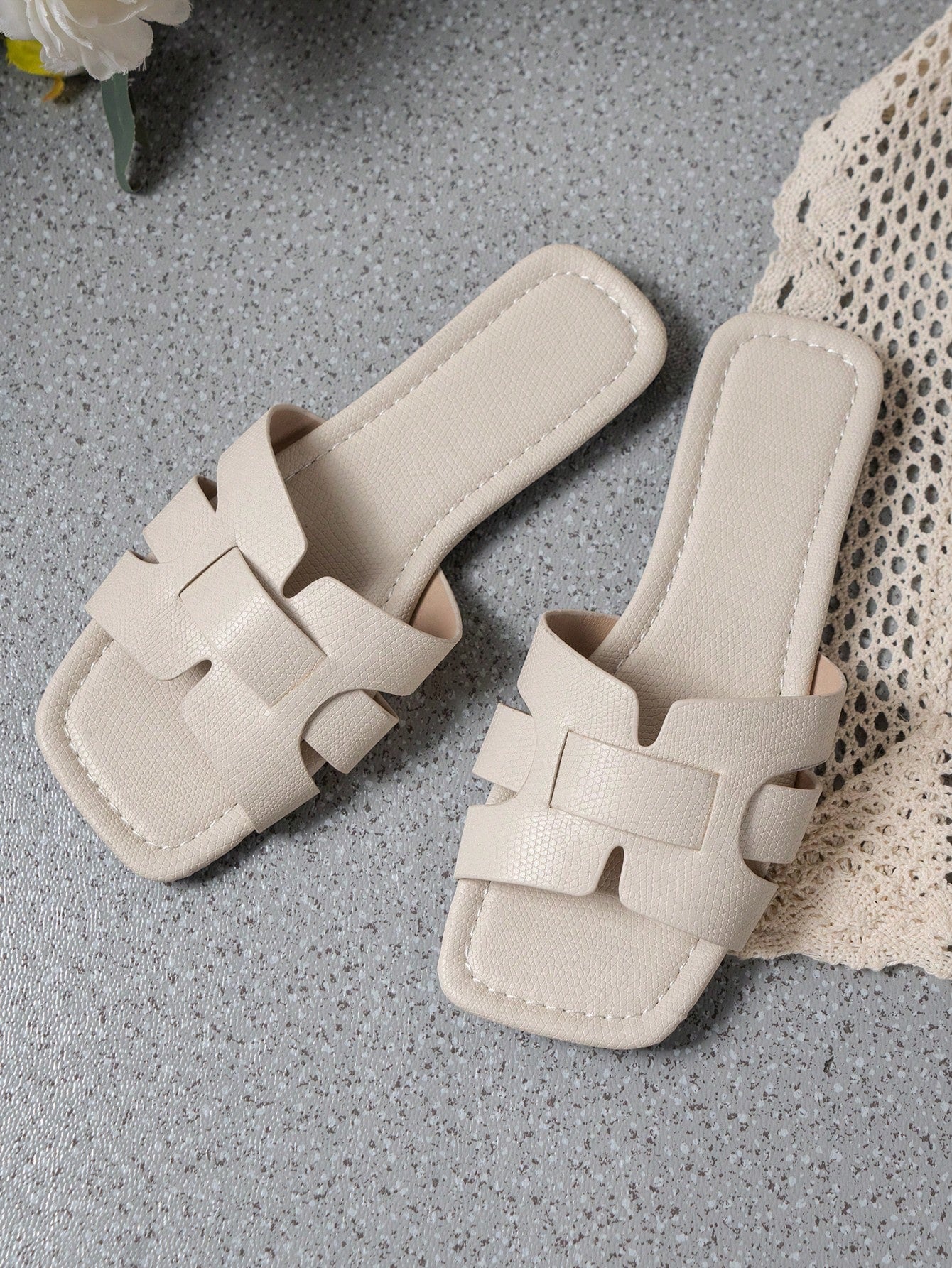 Women's Korean-style casual flat slide sandals with open toe, geometric detail, and pink color.
