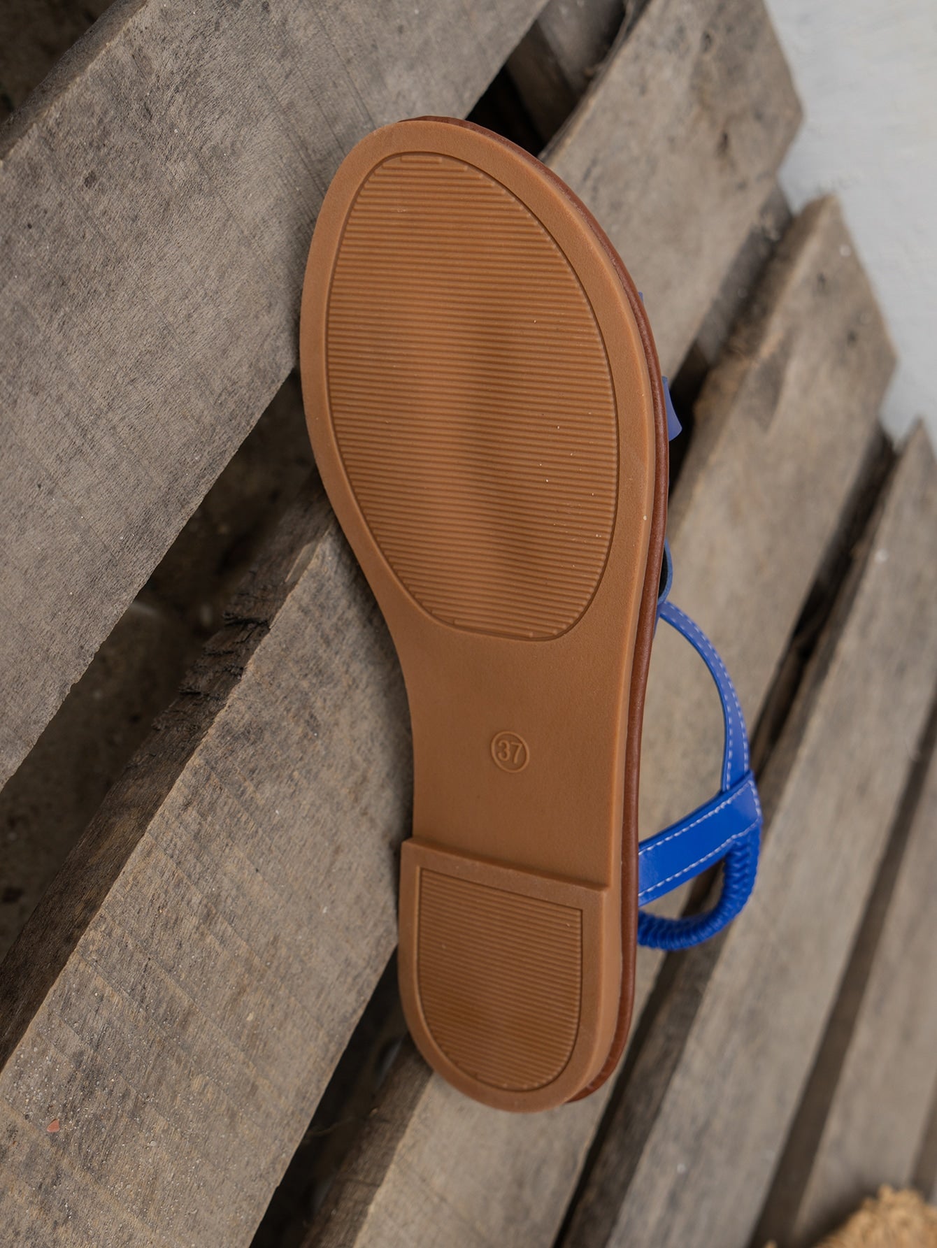 Blue women's flat slide sandals with crisscross straps, open toe, and elastic heel strap, featuring a PU leather upper and non-slip TPR sole for casual beach and outdoor wear.