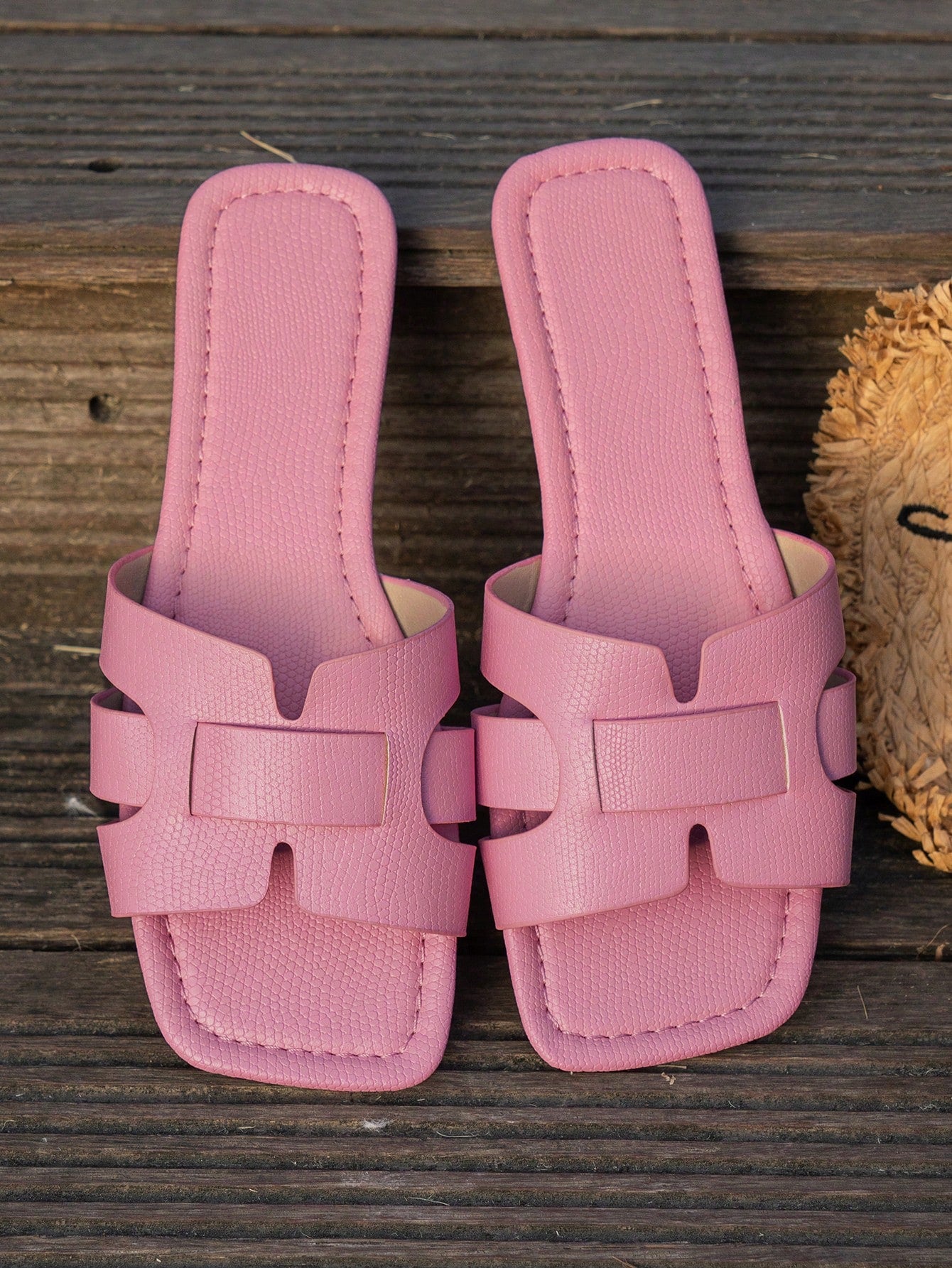Women's Korean-style casual flat slide sandals with open toe, geometric detail, and pink color.