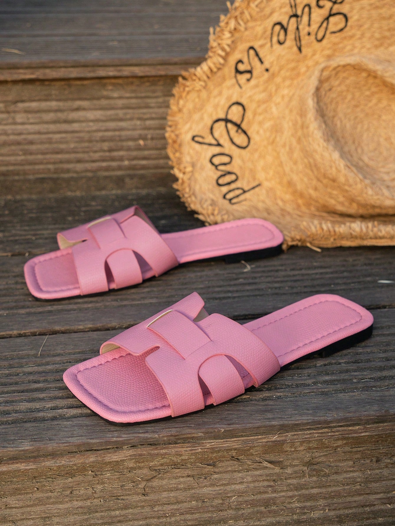 Women's Korean-style casual flat slide sandals with open toe, geometric detail, and pink color.