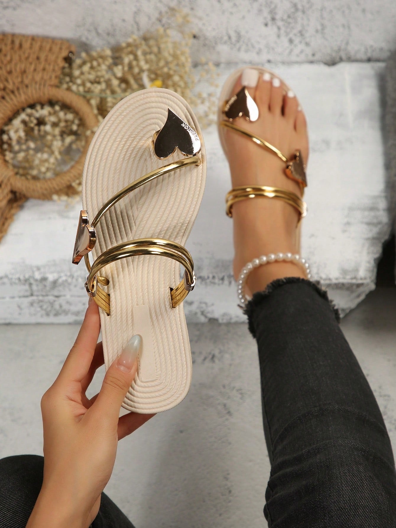 Women's open-toe strappy flat sandals with tasseled upper, seashell-inspired decoration, and rhinestone detail, designed for lightweight, comfortable beach and casual indoor or outdoor wear.
