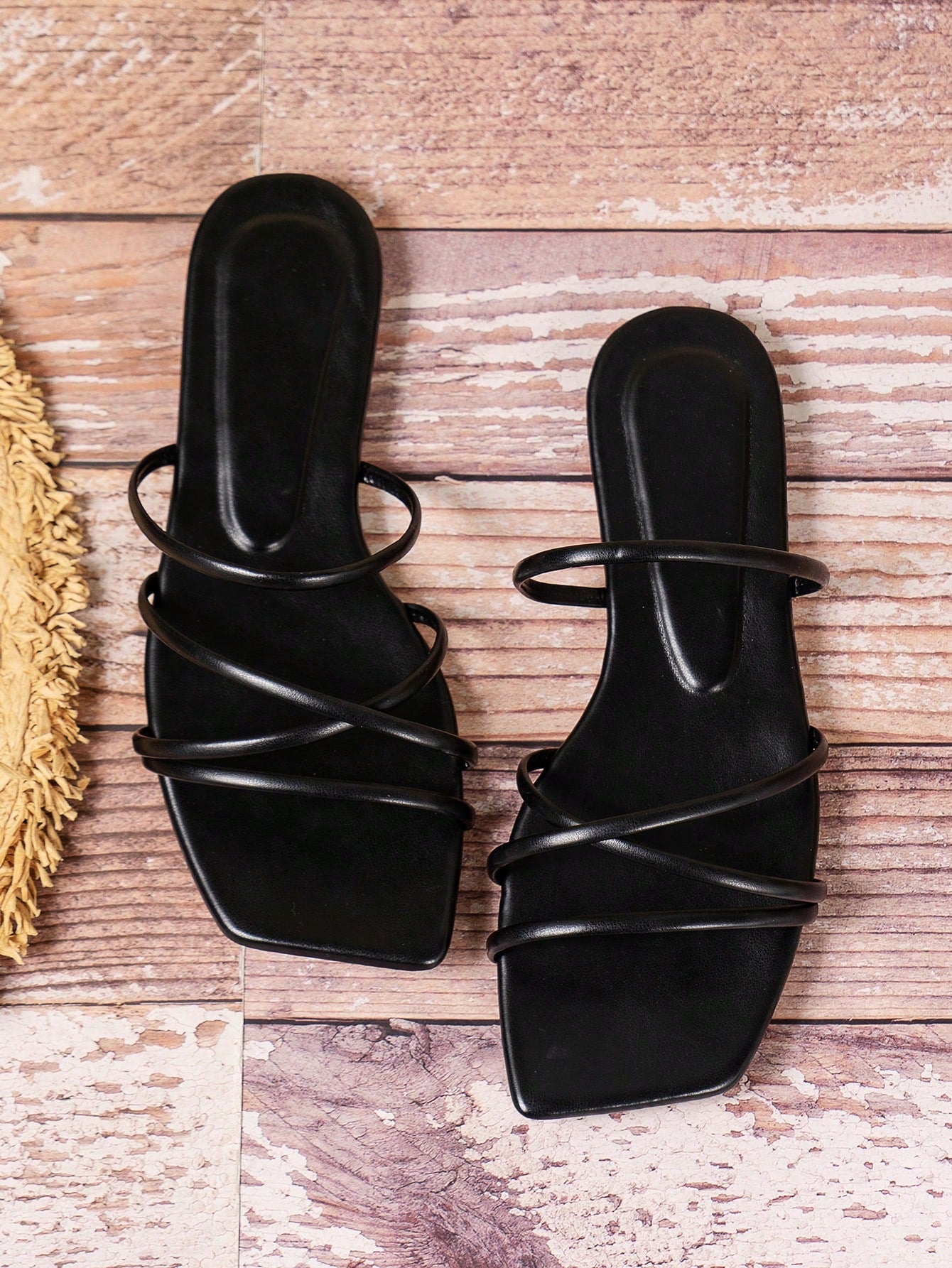 Solid color PU leather flat sandals with criss-cross straps, open toe, and ankle strap design for beach and holiday summer wear.