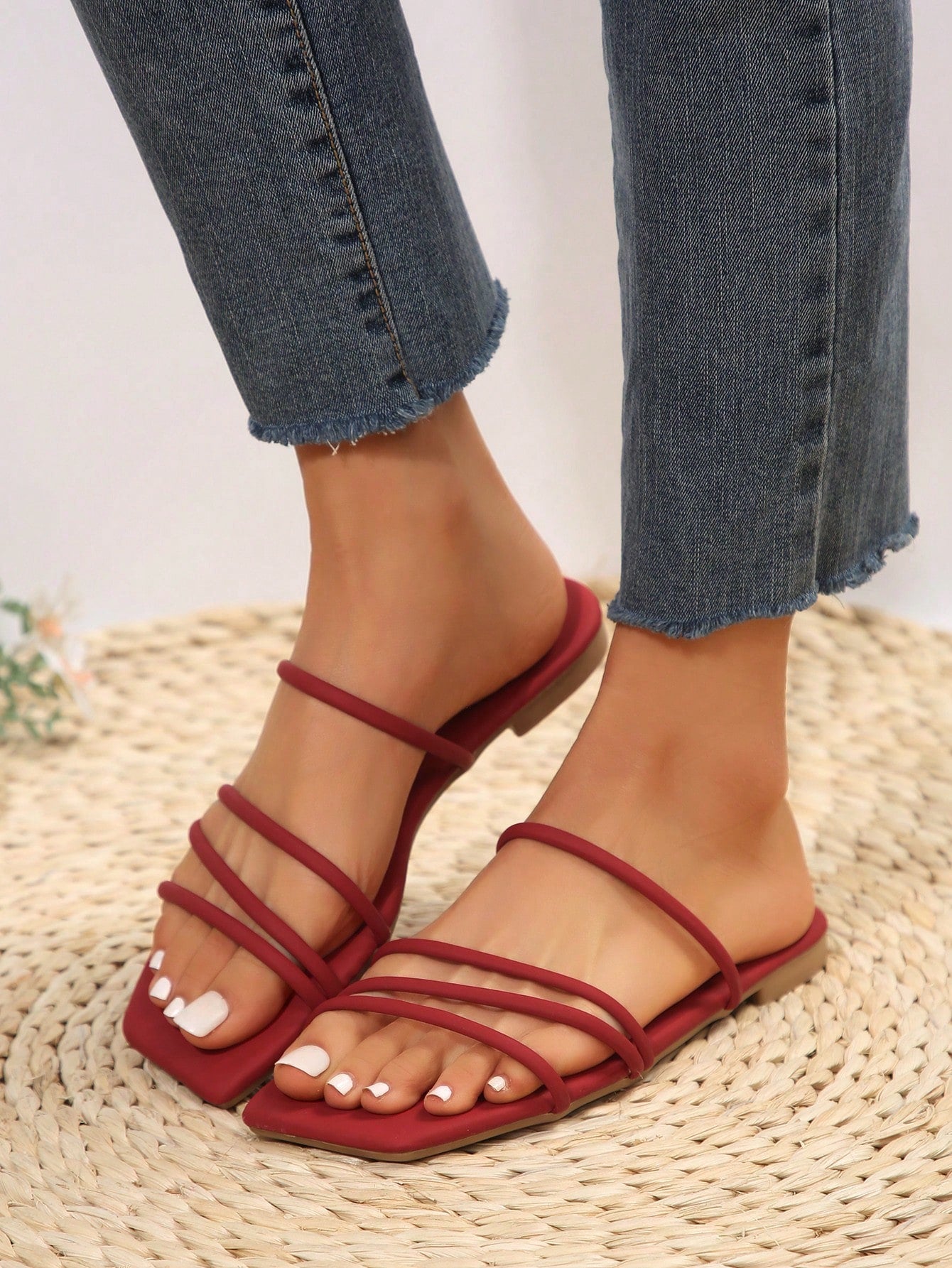 Casual striped flat slide sandals with beaded detail and open toe, beach-style slip-on design.