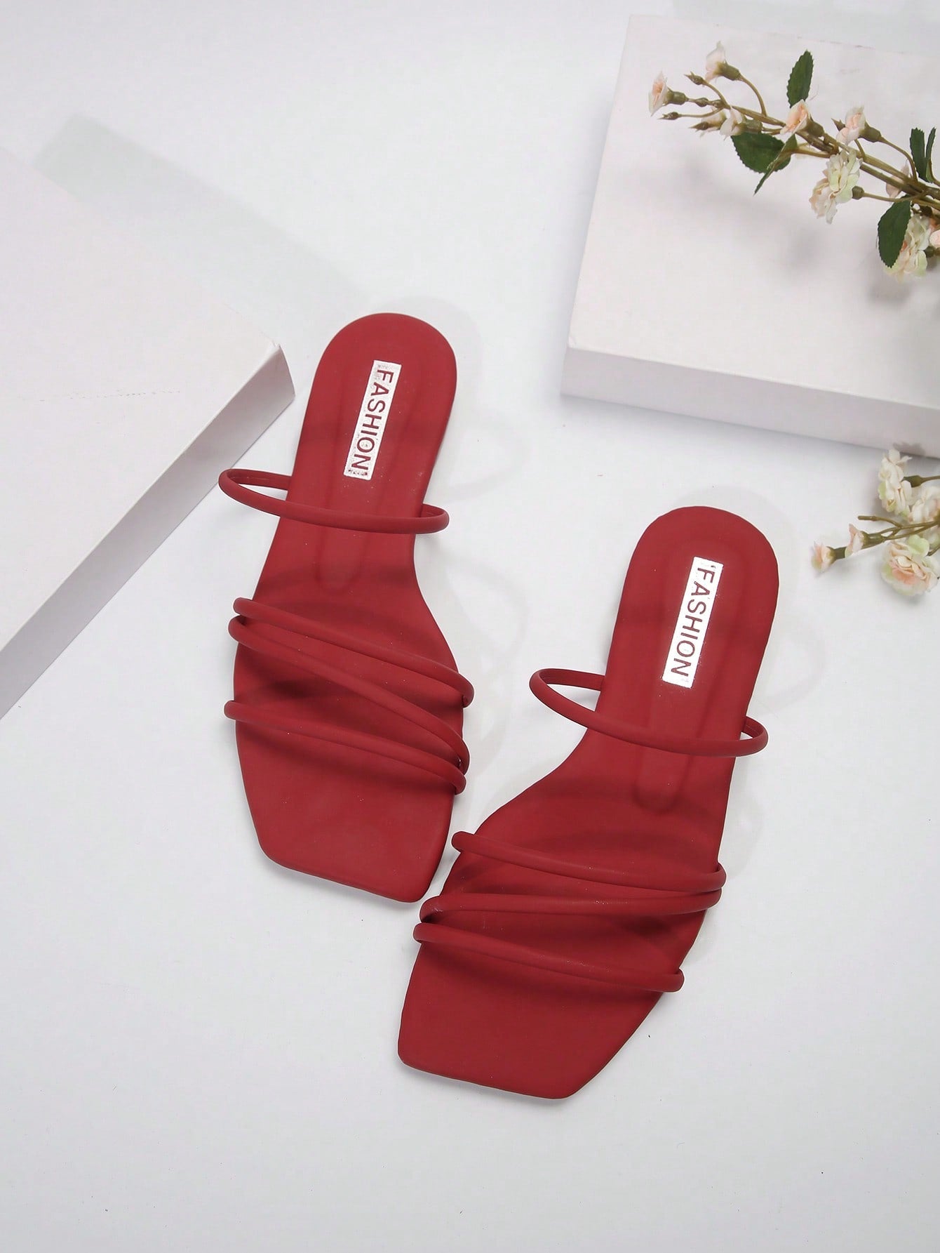 Casual striped flat slide sandals with beaded detail and open toe, beach-style slip-on design.