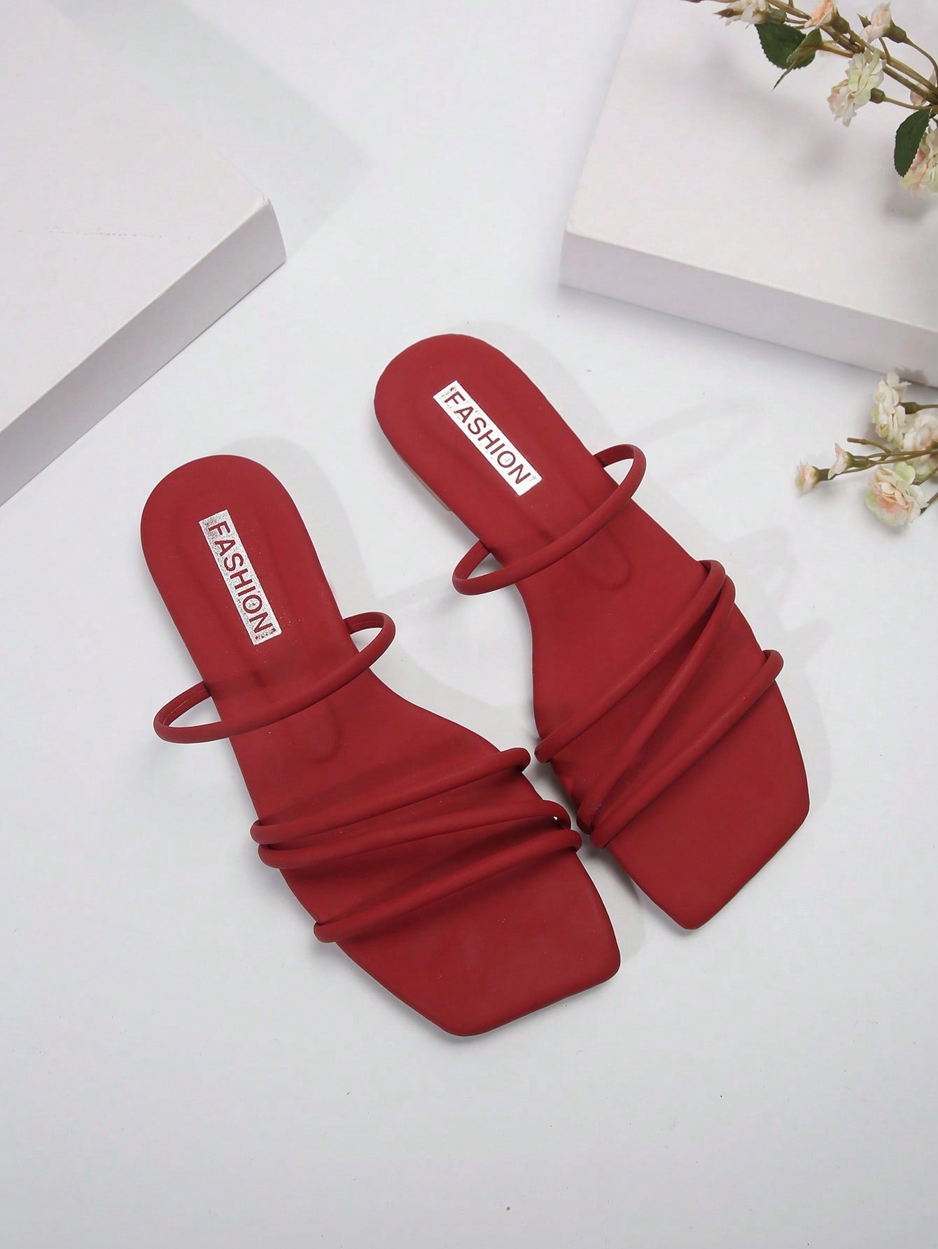 Casual striped flat slide sandals with beaded detail and open toe, beach-style slip-on design.