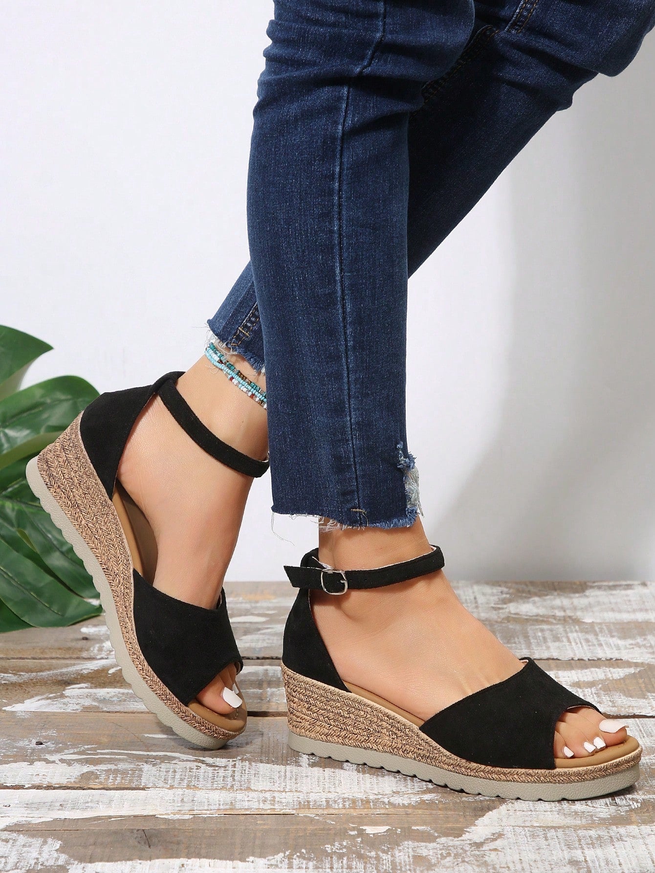 Women's classic wedge sandals featuring a peep open toe, ankle strap with buckle closure, mid wedge heel, and large bow detail in a bohemian beach style.