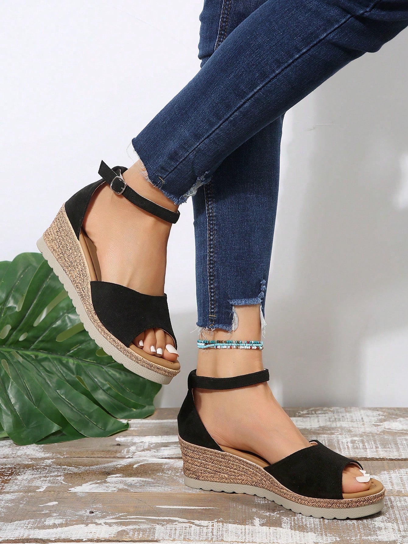Women's classic wedge sandals featuring a peep open toe, ankle strap with buckle closure, mid wedge heel, and large bow detail in a bohemian beach style.