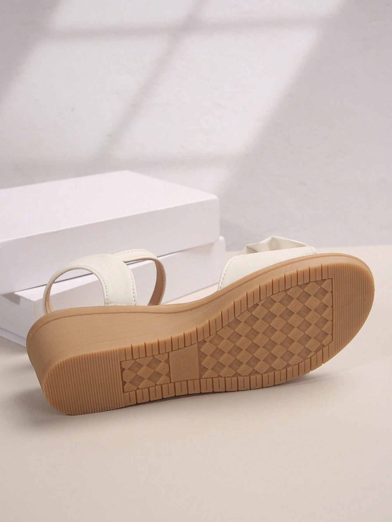 Women's open-toe wedge sandals featuring a thick sole, mid wedge heel, bowknot detail, and single buckle ankle strap.