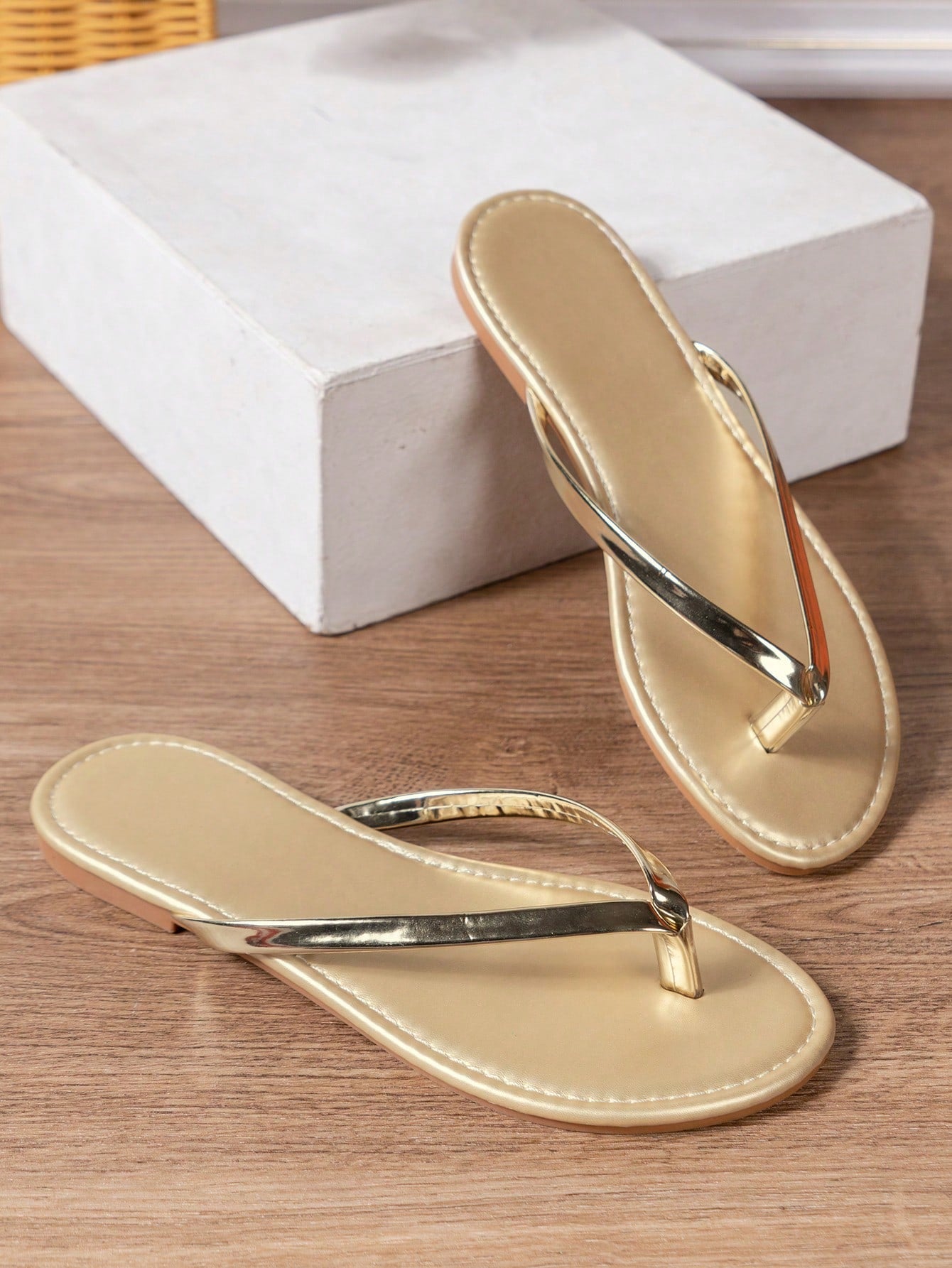 Women's criss cross thong flip flops with lace-up detail, flat sole, and non-slip outsole, suitable for beach, holiday, and casual walking wear.
