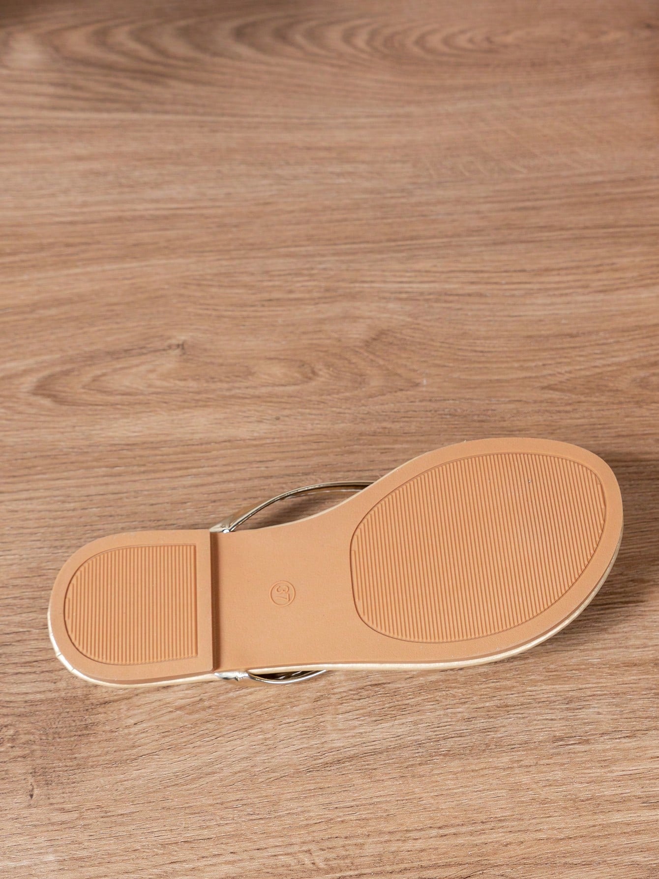 Women's criss cross thong flip flops with lace-up detail, flat sole, and non-slip outsole, suitable for beach, holiday, and casual walking wear.