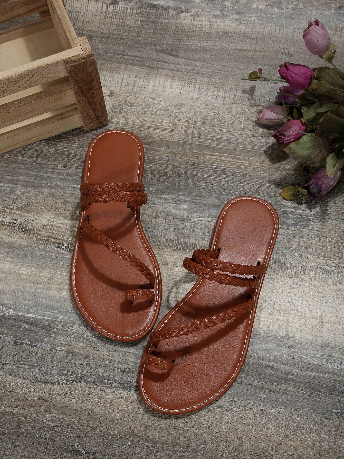Women's flat slip-on sandal with toe ring and cross-over strappy upper, designed for casual beach and outdoor wear with an anti-slip sole.