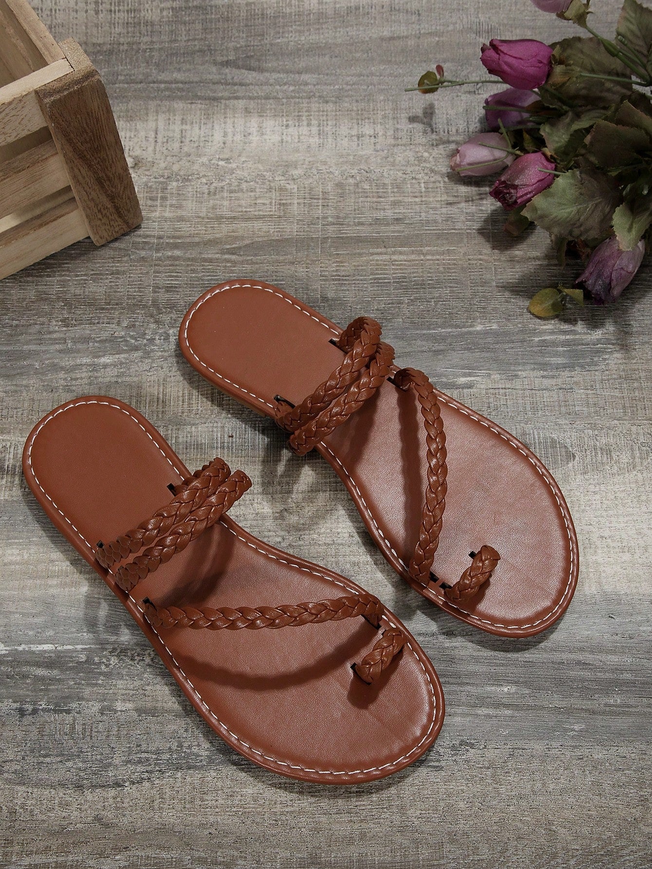 Women's flat slip-on sandal with toe ring and cross-over strappy upper, designed for casual beach and outdoor wear with an anti-slip sole.