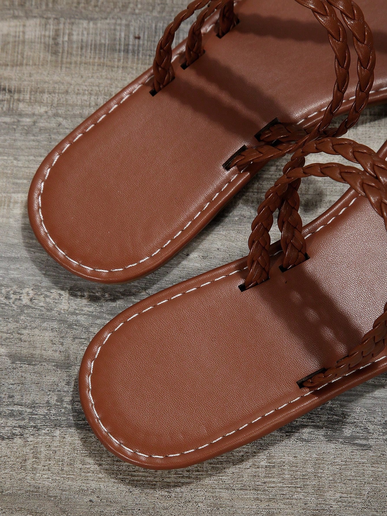 Women's flat slip-on sandal with toe ring and cross-over strappy upper, designed for casual beach and outdoor wear with an anti-slip sole.