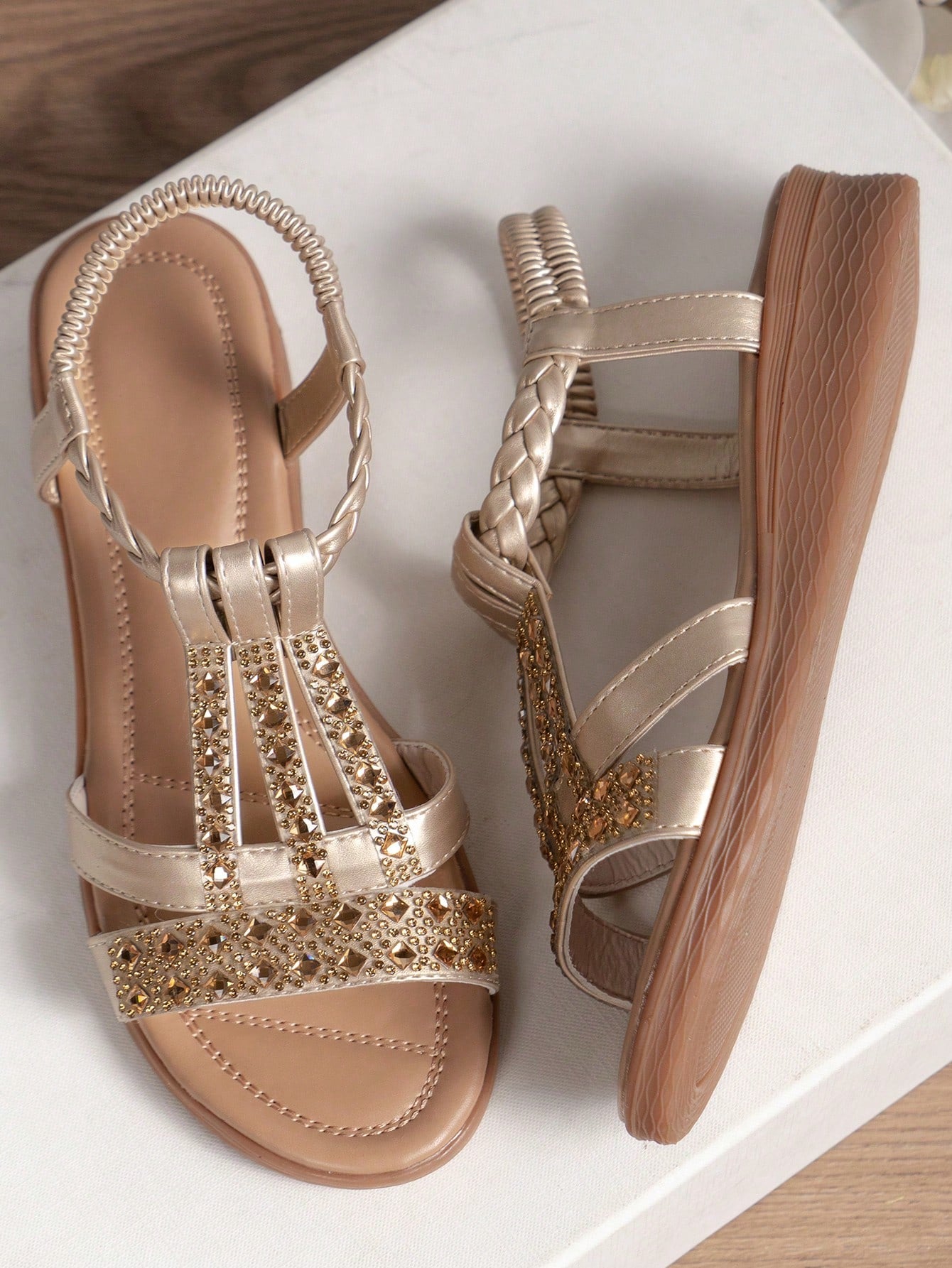 Women's bohemian rhinestone strappy flat sandals with open toe, designed as comfortable non-slip beach shoes.
