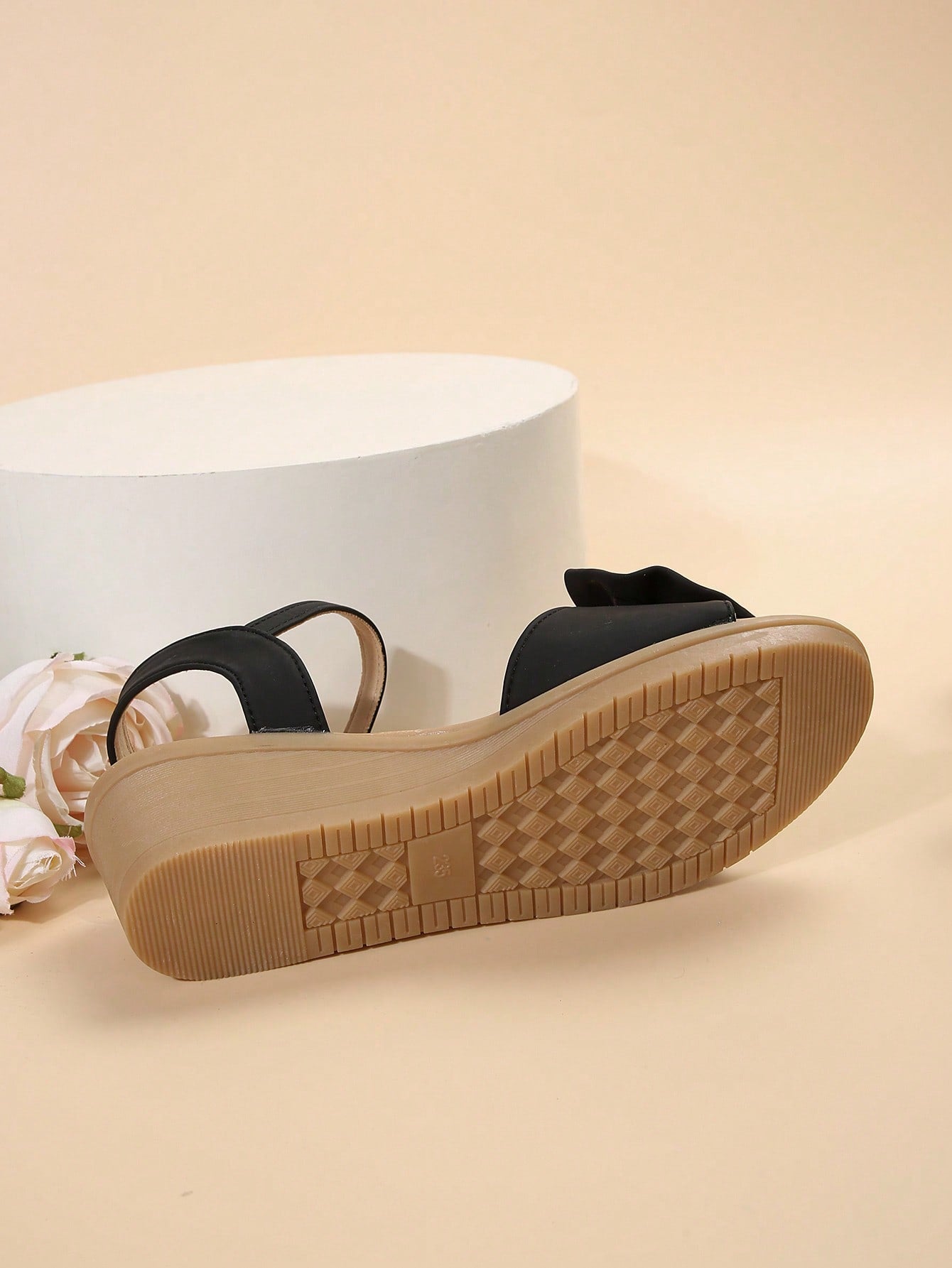 Women's open-toe wedge sandals featuring a thick sole, mid wedge heel, bowknot detail, and single buckle ankle strap.